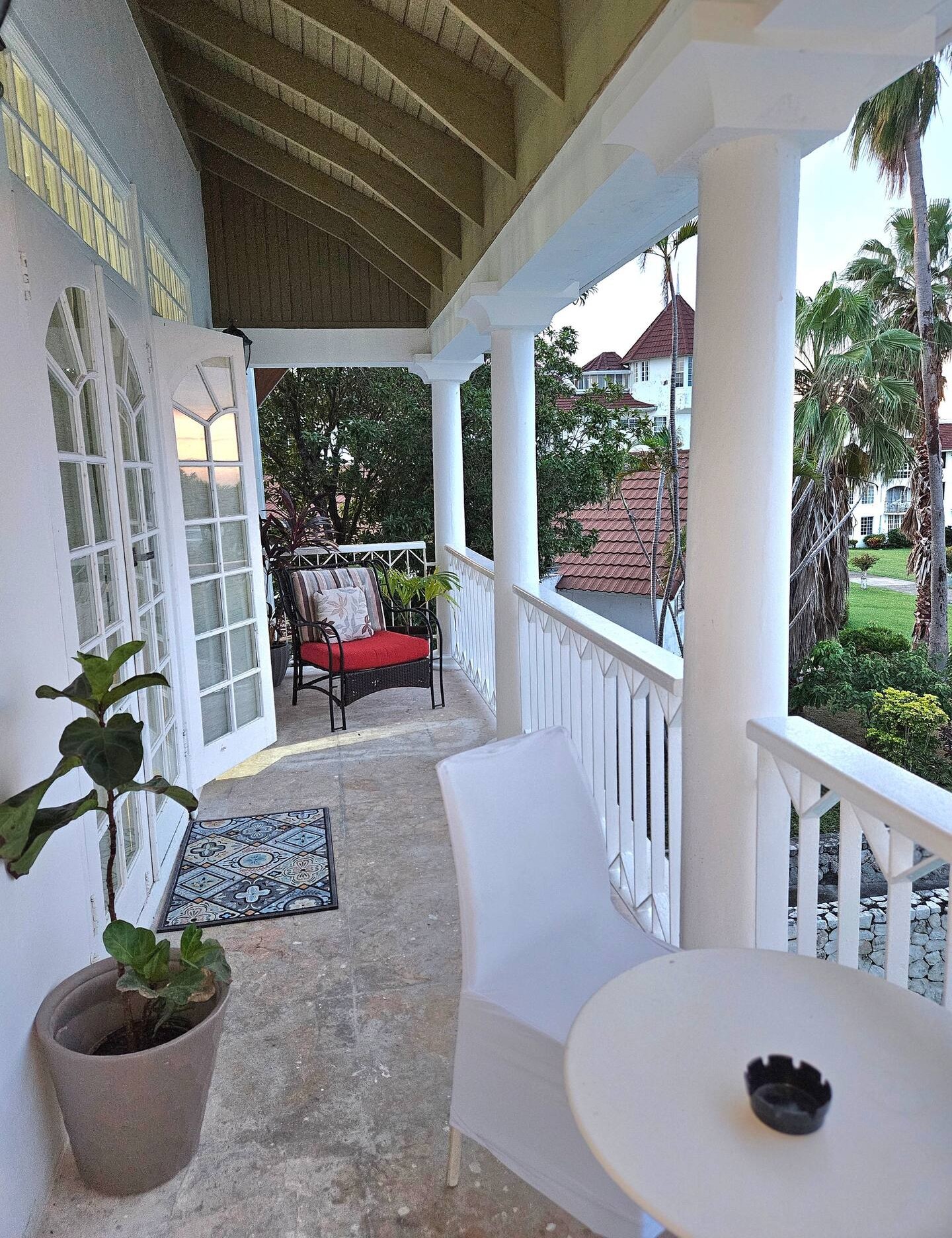 Colonial Veranda with French Doors, White Pillars & Garden Breezes