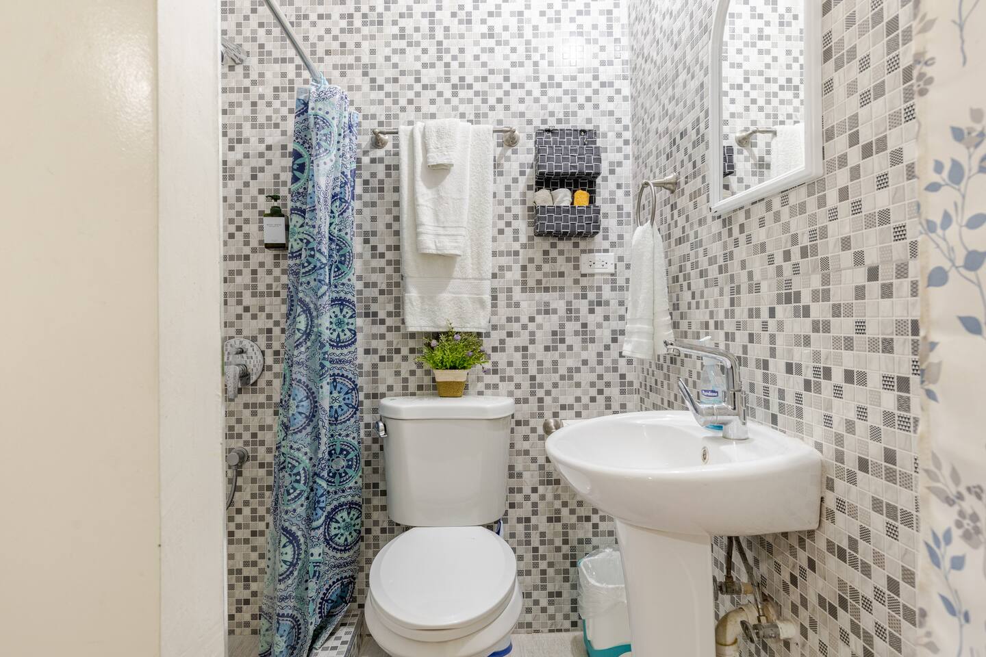 Clean Mosaic Tiled Bathroom & Pedestal Sink Vanity
