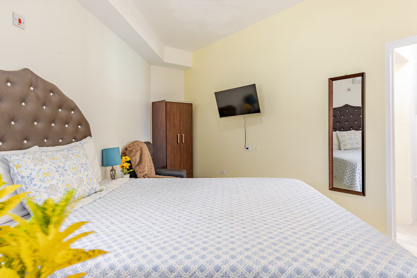 Master Suite with Crystal-Tufted Headboard, Wall-Mounted Flat Screen TV & Wardrobe