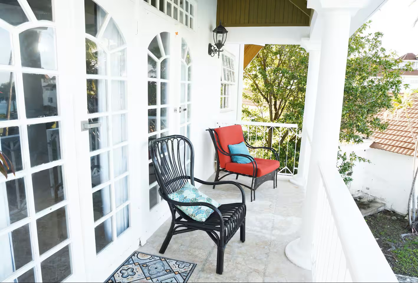 Colonial Veranda with Arched French Doors & Wicker Armchairs