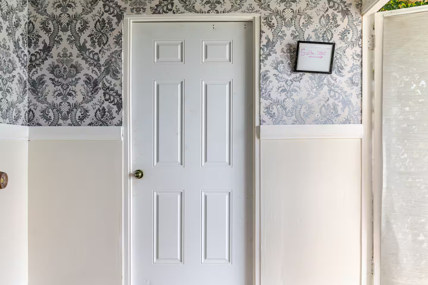 Private Suite Entrance Door with Vintage Damask Hallway Decor