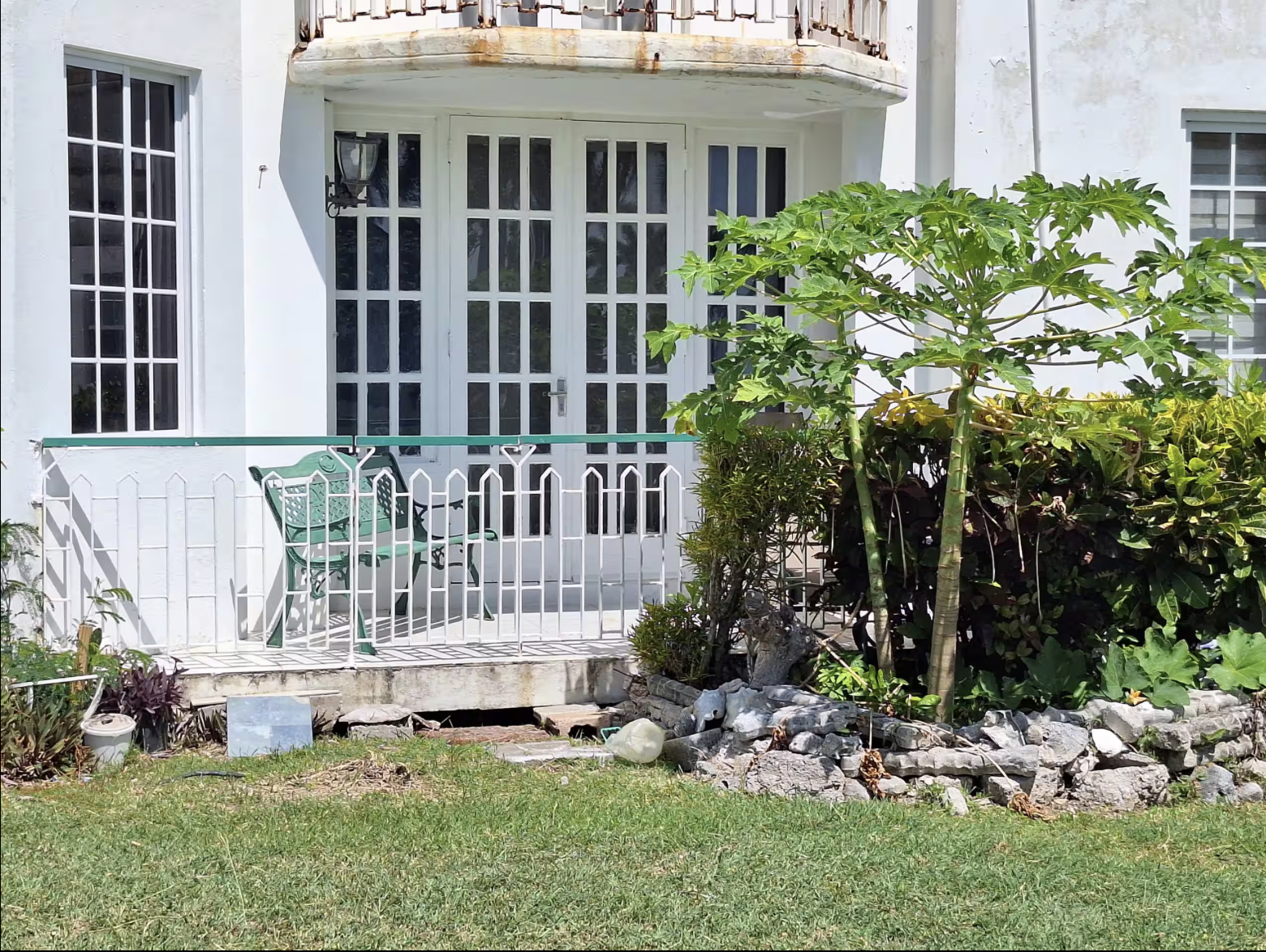 Colonial Architecture Suite Exterior with Private Garden Veranda, Vintage Green Bench & Tropical Garden