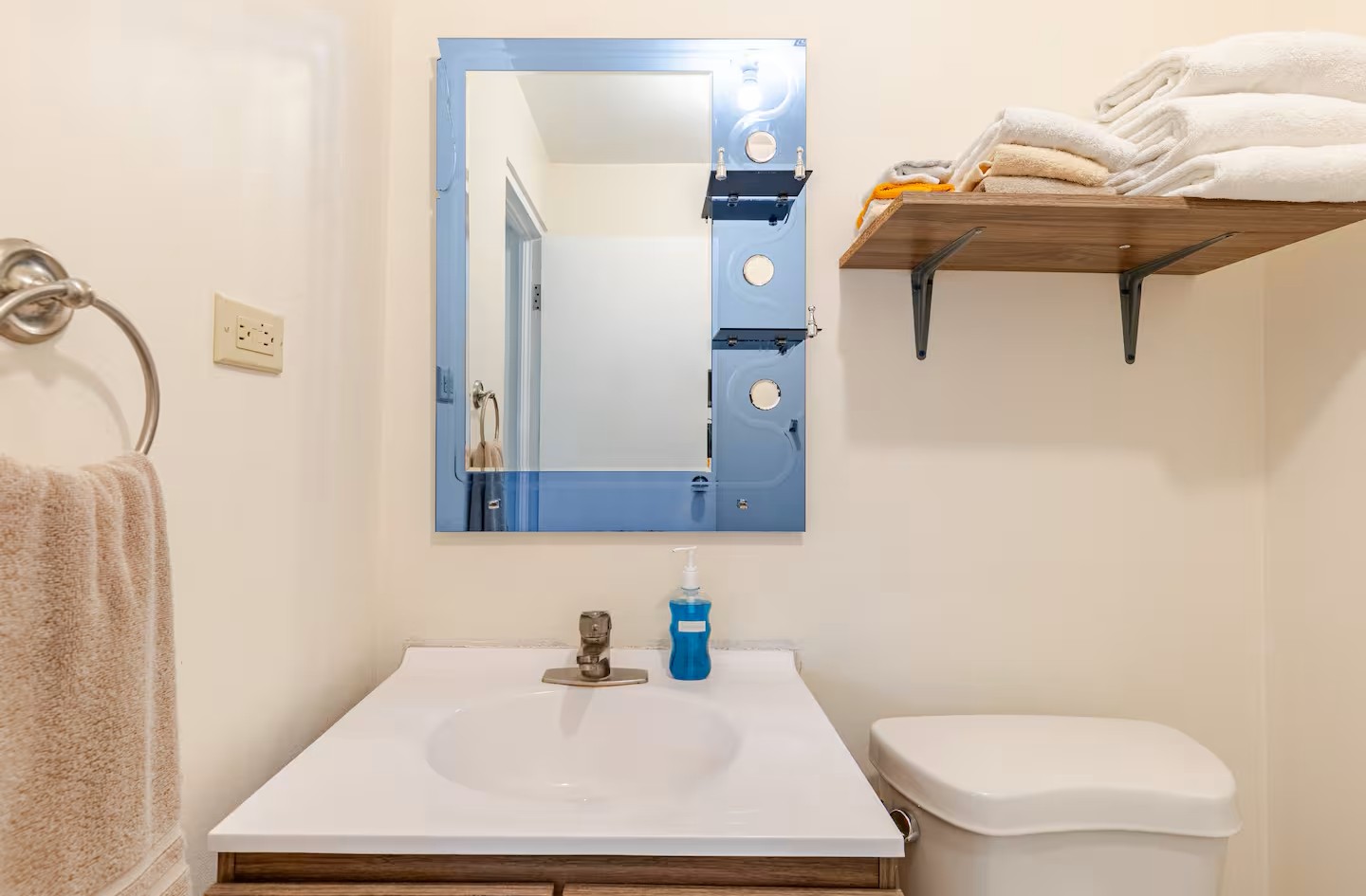 Modern Bathroom Vanity with Blue Framed Mirror & Fresh Towel Shelf
