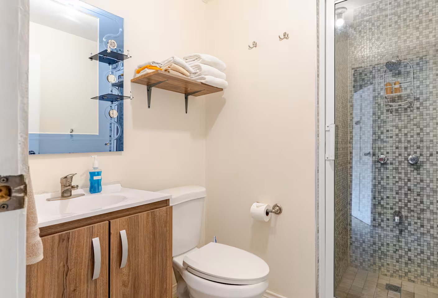 Renovated Bathroom with Mosaic Glass Tiled Walk-In Shower & Vanity