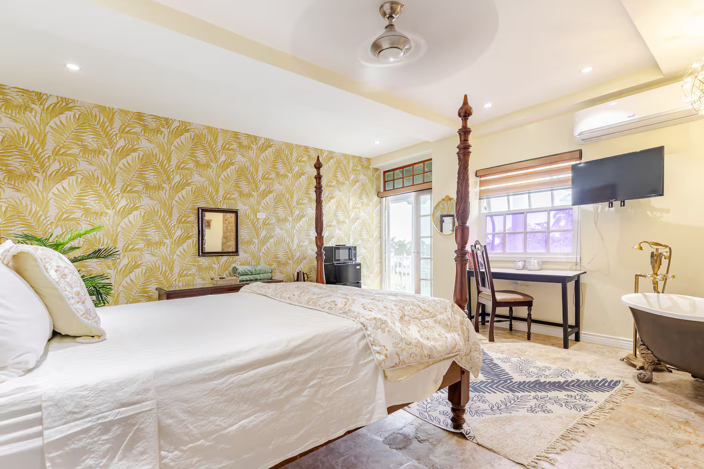 Spacious Studio Perspective with Four-Poster Bed, Workspace & Luxury Tub