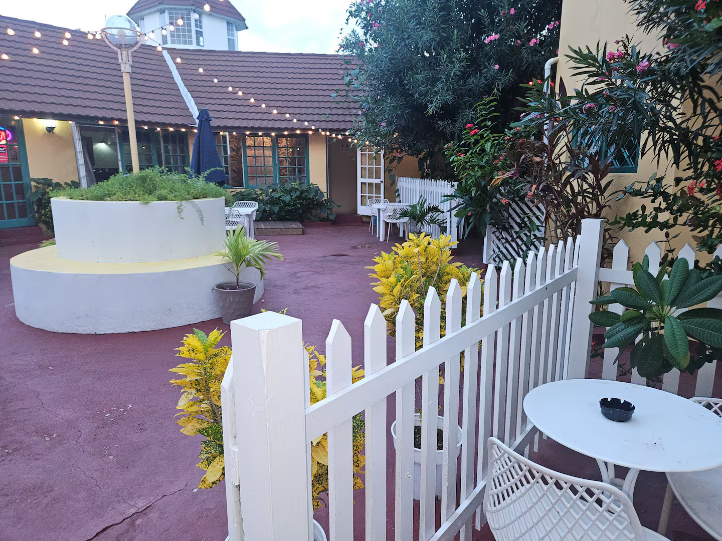Charming Courtyard with Bistro Lights & Tropical Gardens