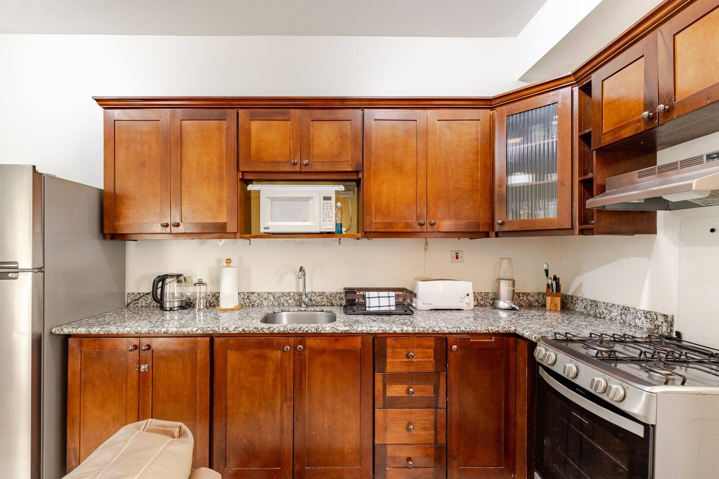 Full Chef's Kitchen with Solid Wood Cabinetry, Gas Range, Microwave & Granite Counters