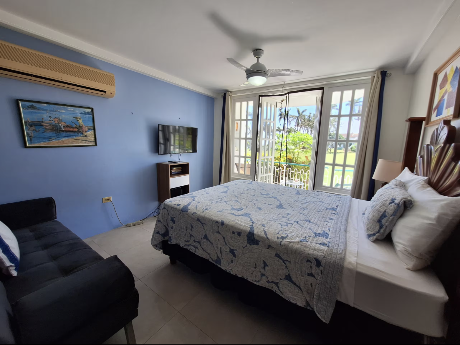 Master Bedroom Suite with Blue Accent Wall, Daybed, Flat-Screen TV & French Balcony Doors