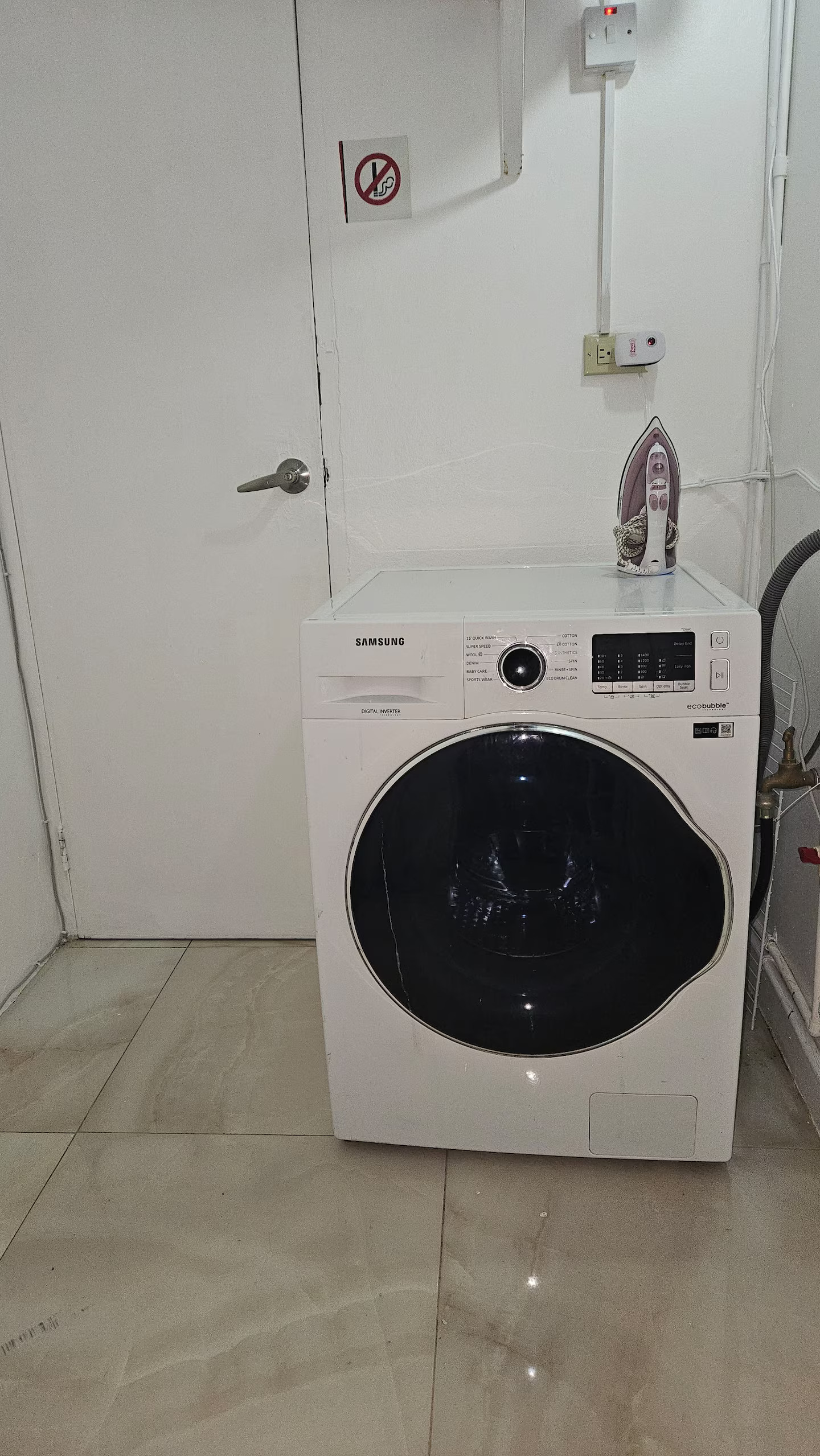 In-Unit Laundry Nook Featuring Front-Load Samsung Eco-Bubble Washer & Steam Iron