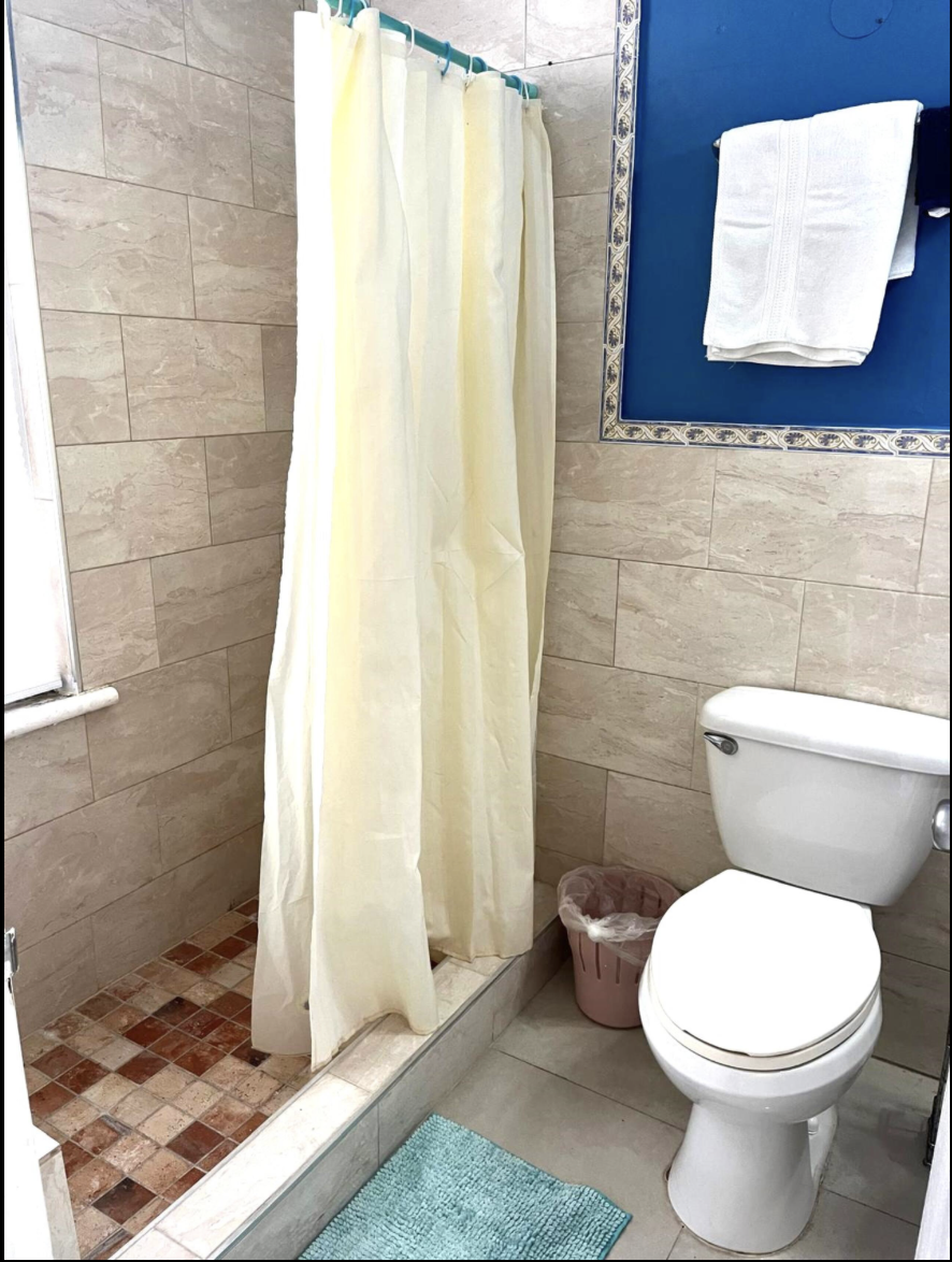 Ensuite Bath with Ceramic Tile Surround, Fresh Towel Rack & Shower Curtain