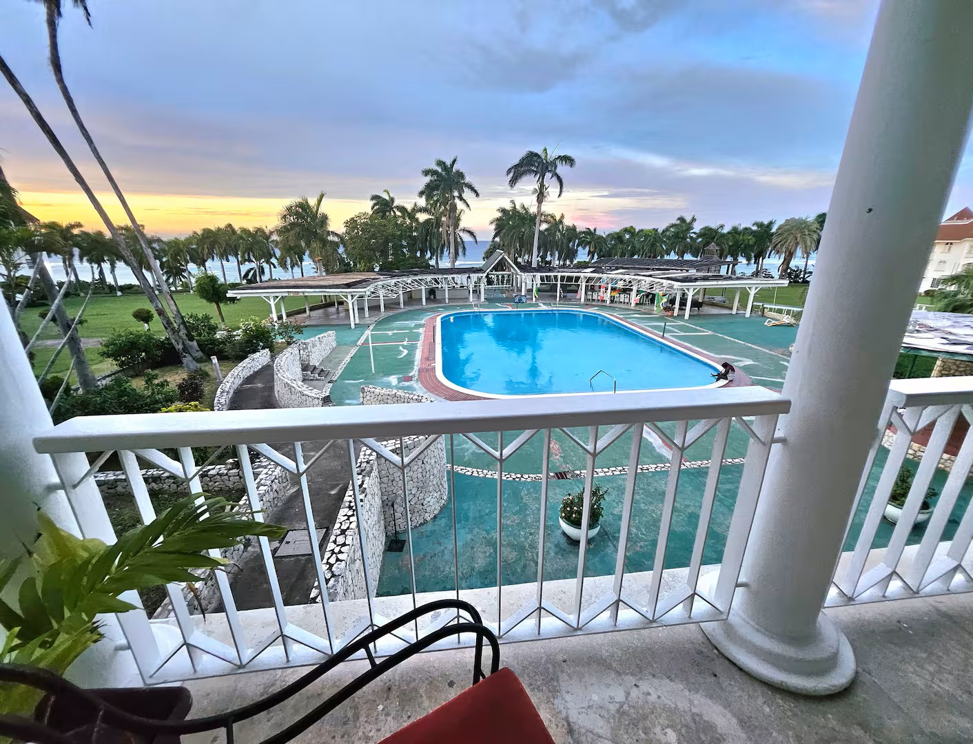 Sunset Balcony Panoramic View of Swimming Pool & Caribbean Horizon
