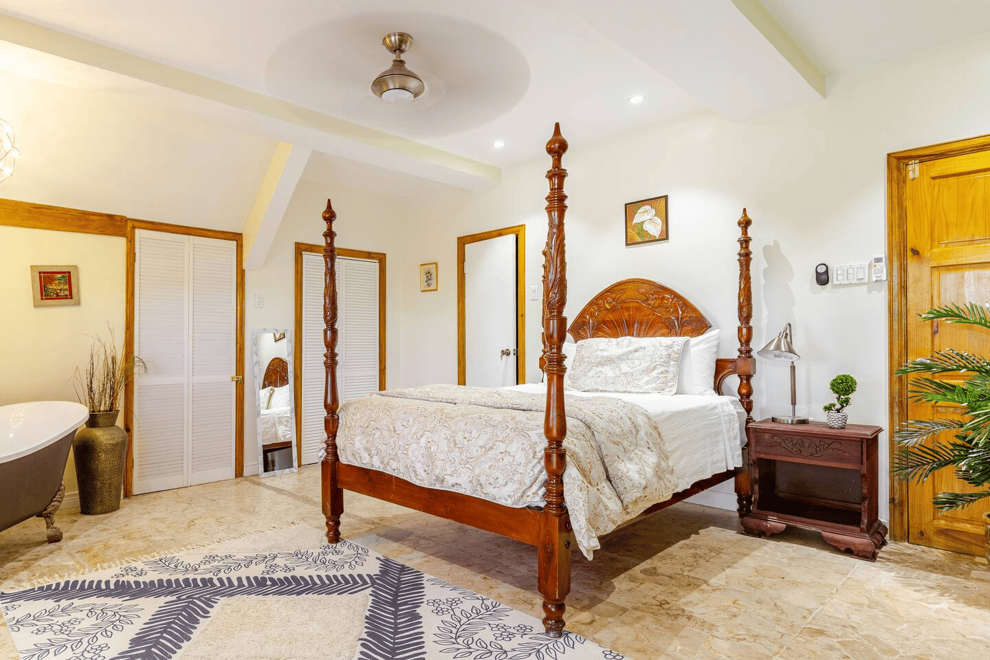Spacious Master Suite with Hand-Carved Bed, Soaker Tub & High Ceilings
