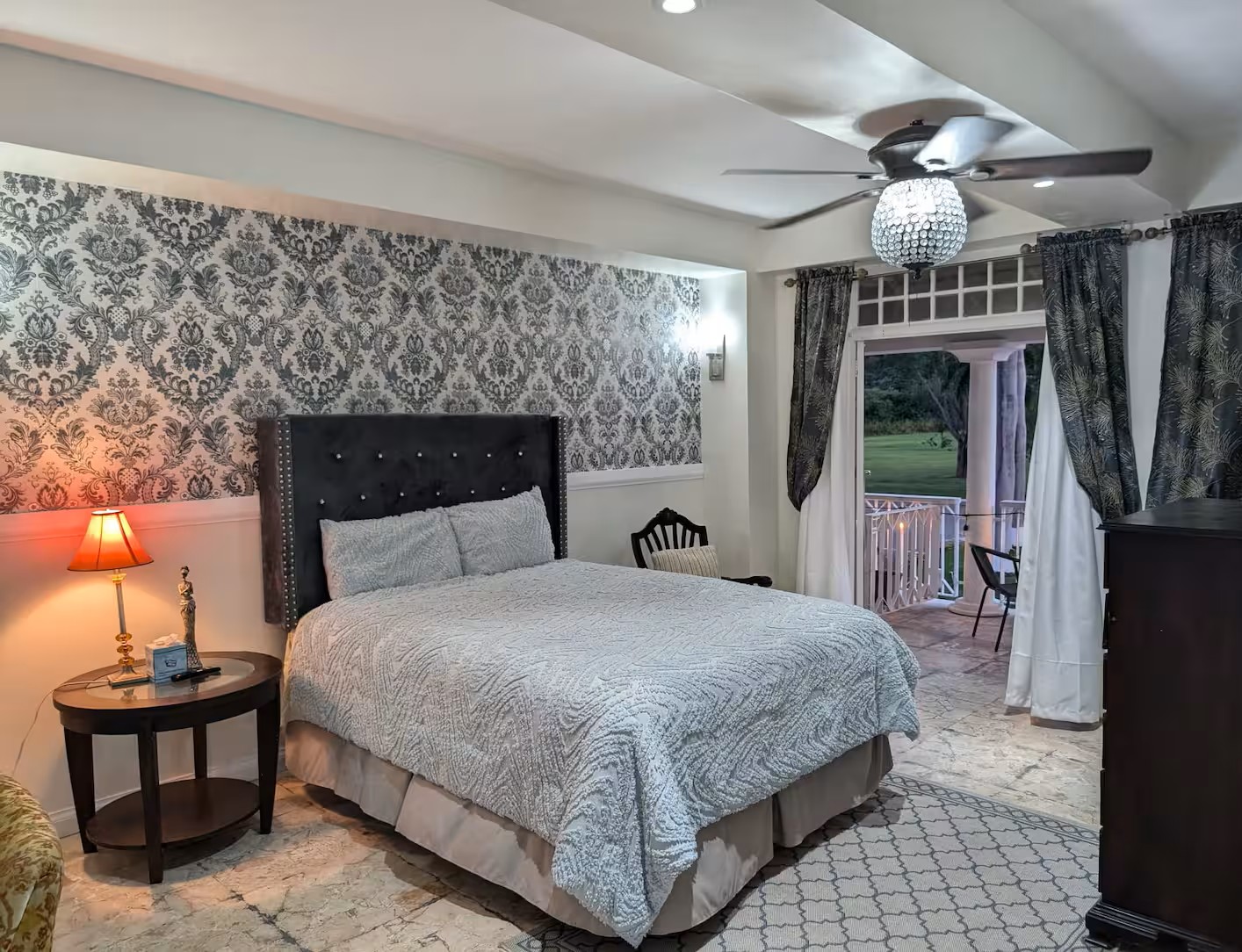 Evening Master Bedroom with Warm Lighting & Veranda Balcony Access