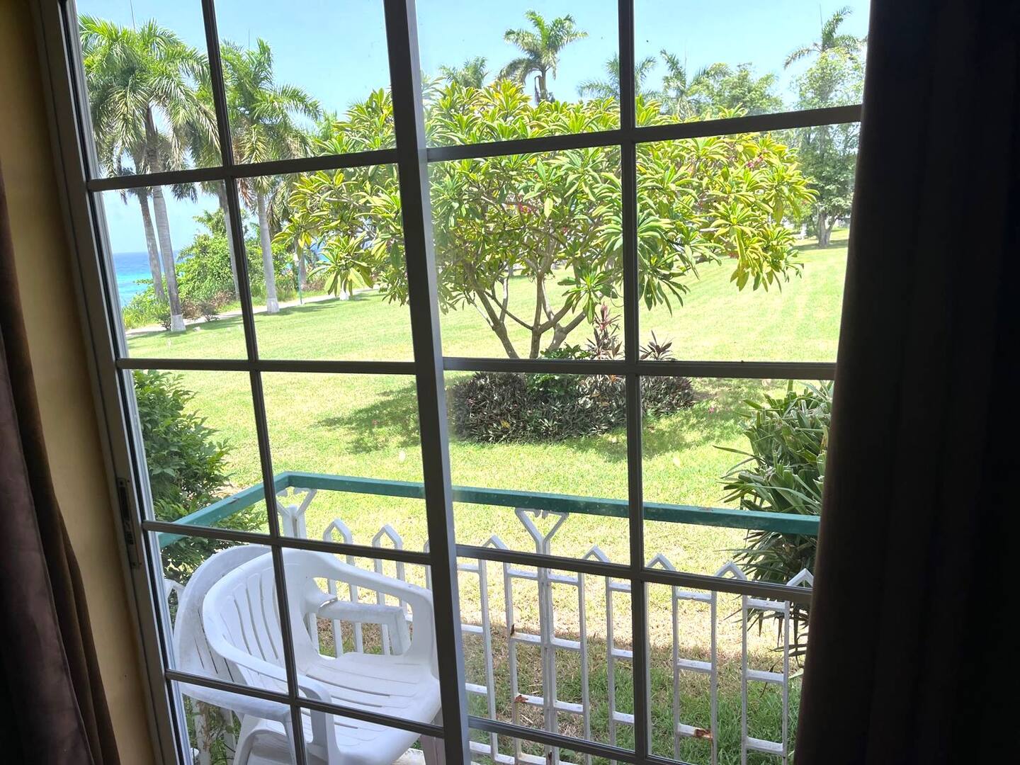 Patio View Through French Grid Doors to Private Bistro Seating & Garden