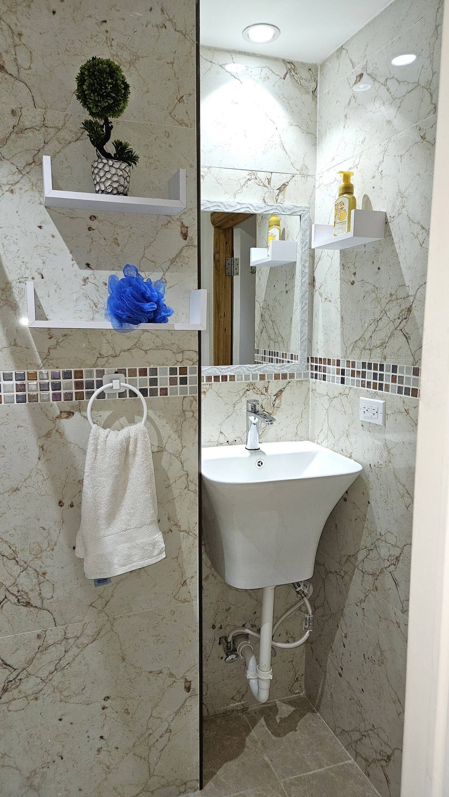 Modern Vanity Sink with Marble Tile & Floating Shelves