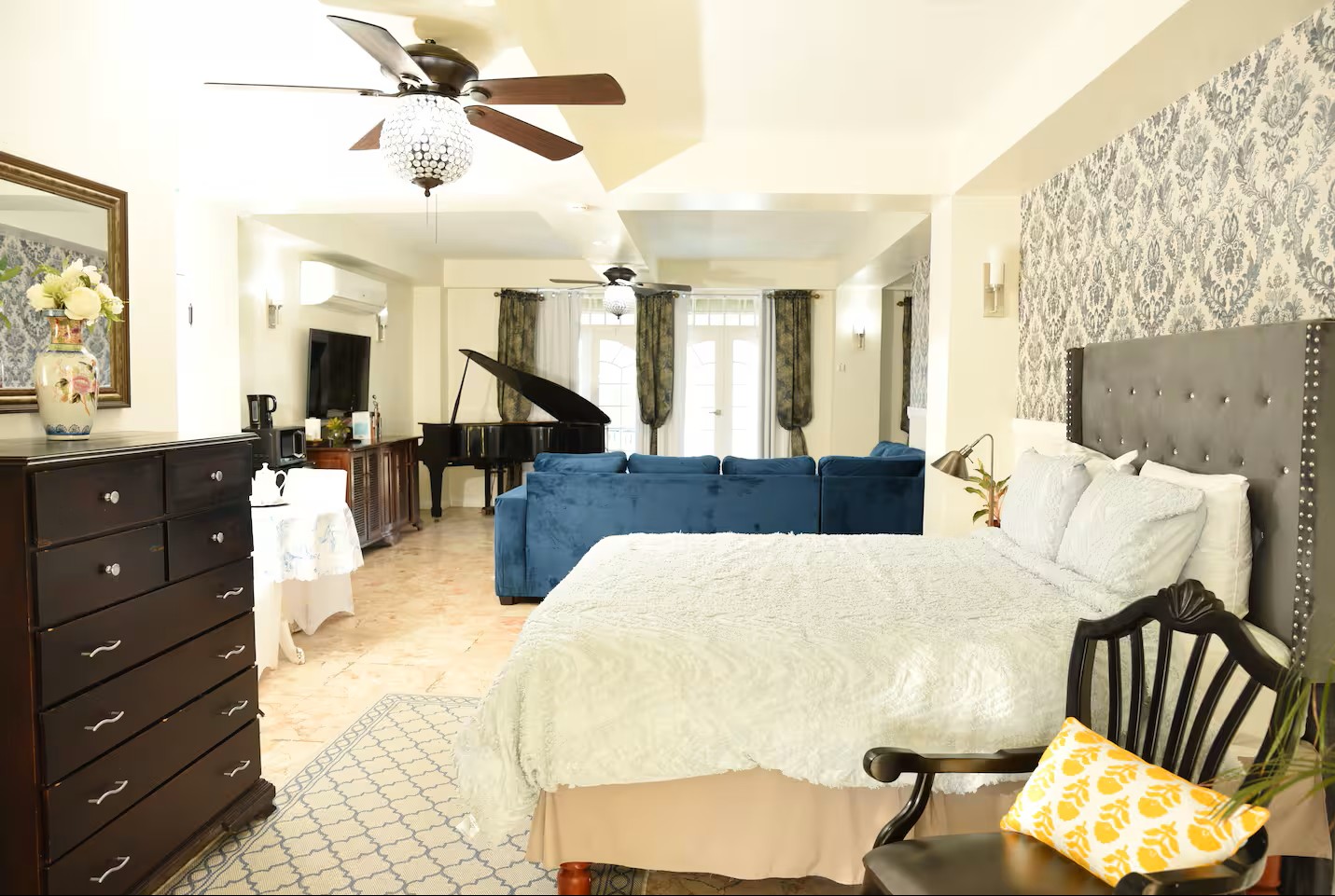 Grand Suite Perspective with Damask Wall, Tufted Headboard & Piano