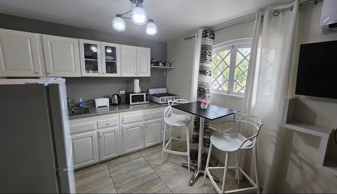 Kitchen & Dining High-Top with Arched Window & Natural Light