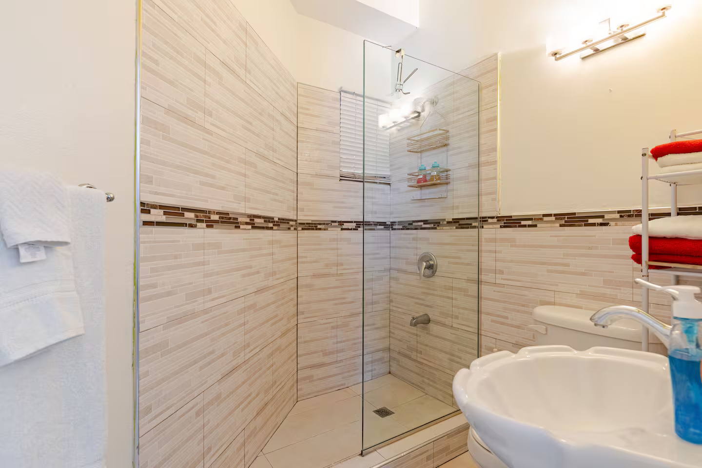 Mosaic Walk-In Shower with Glass Enclosure & Scalloped Shell Basin Sink