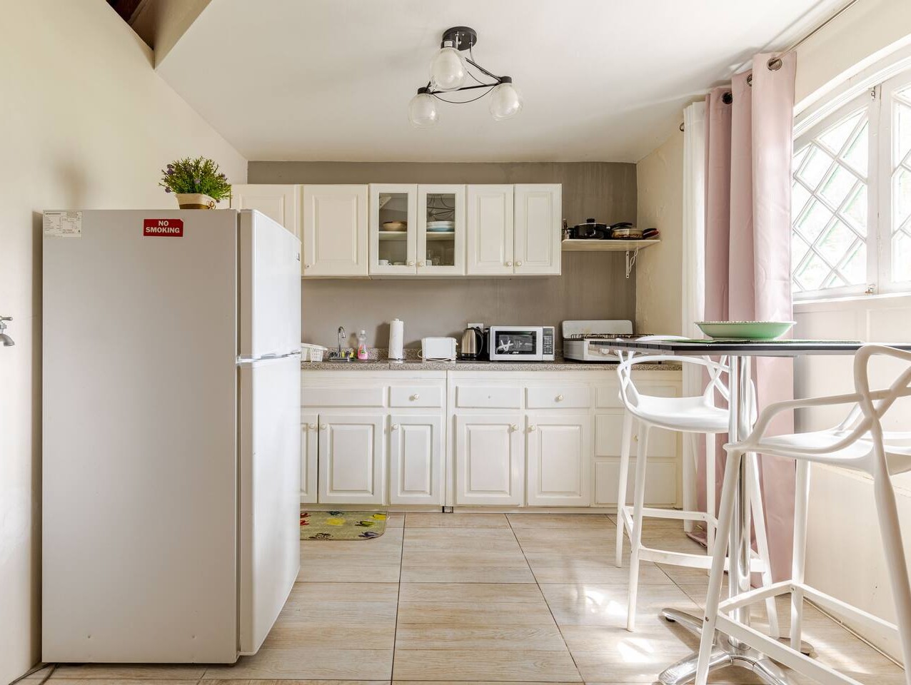 Full Kitchenette with Refrigerator, Microwave, Cabinets & High Dining Table