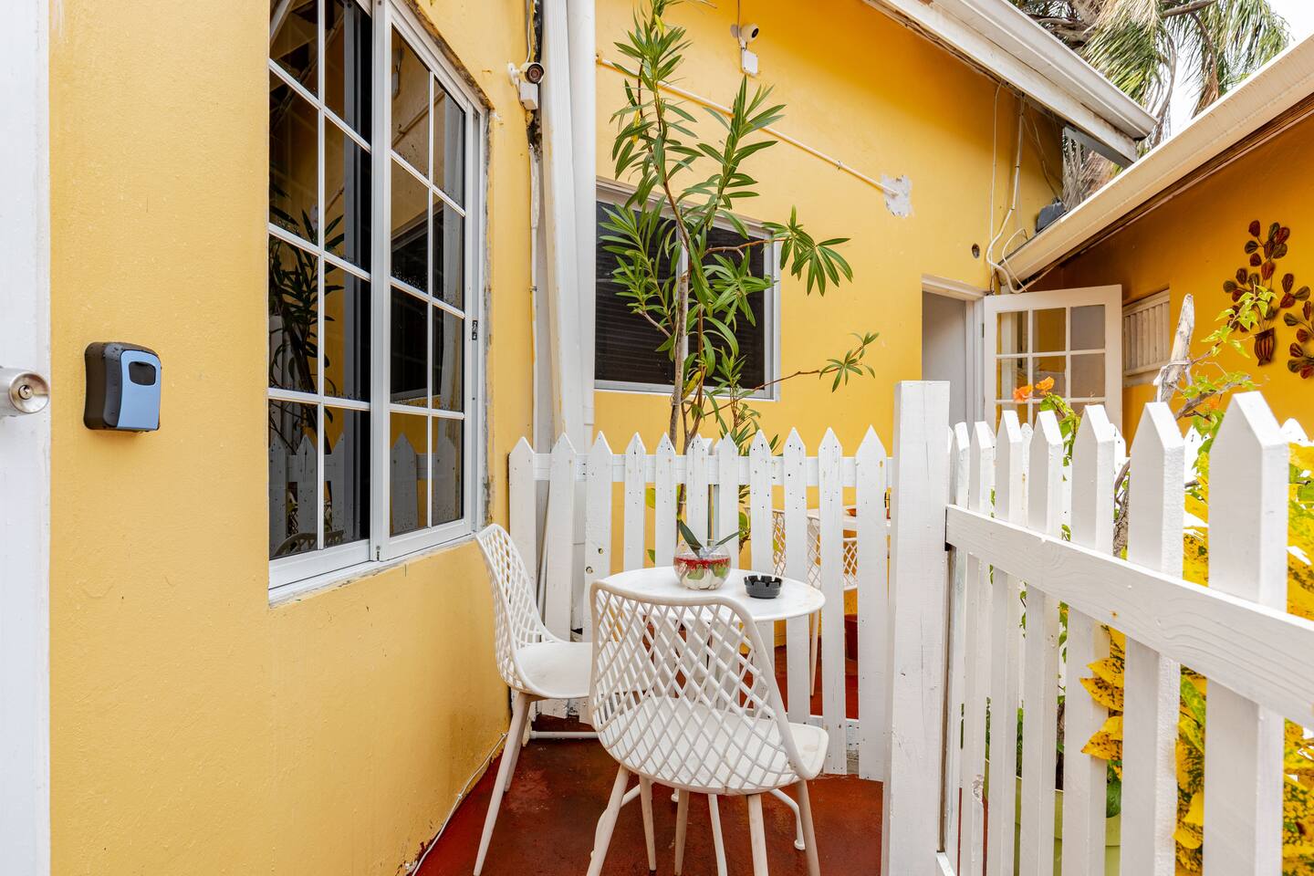 Private Courtyard Patio with Bistro Seating & Garden Fence