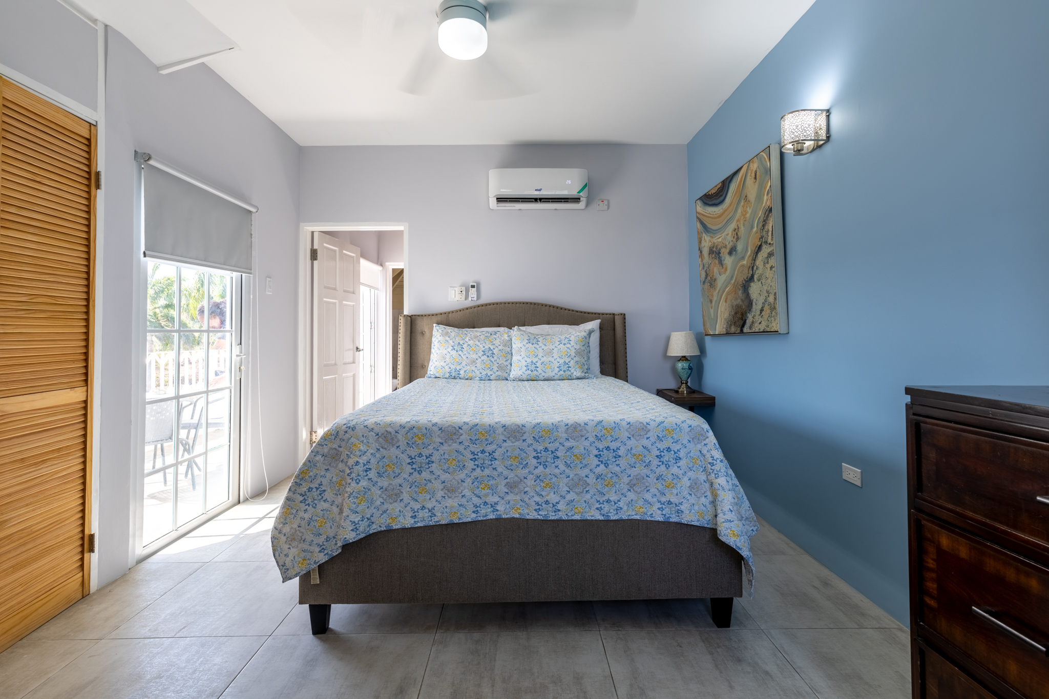 Lux Penthouse 207 - Master Bedroom Suite with Ocean Blue Accent Wall & Balcony Access