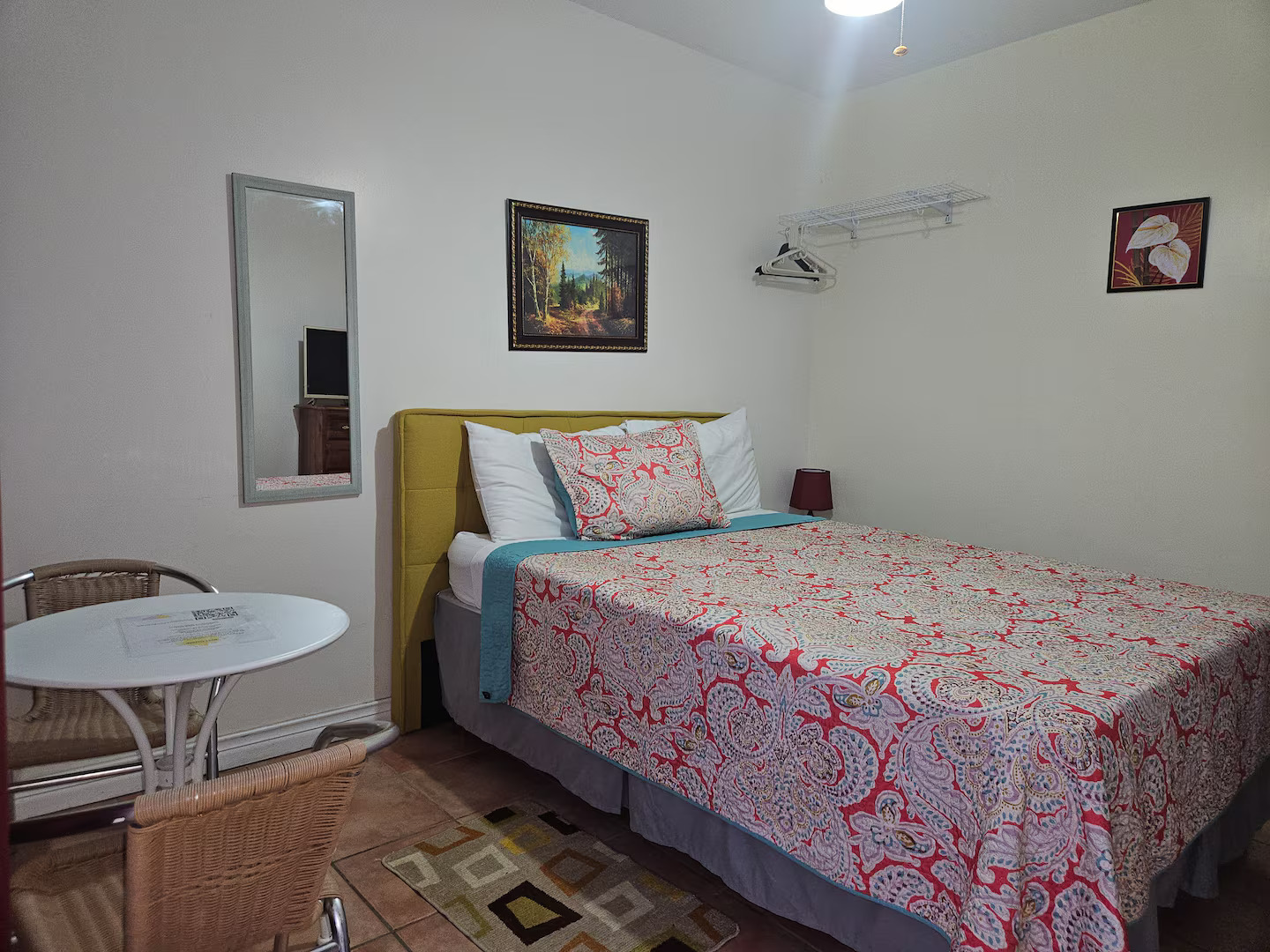 Queen Bed Setup with Yellow Upholstered Headboard
