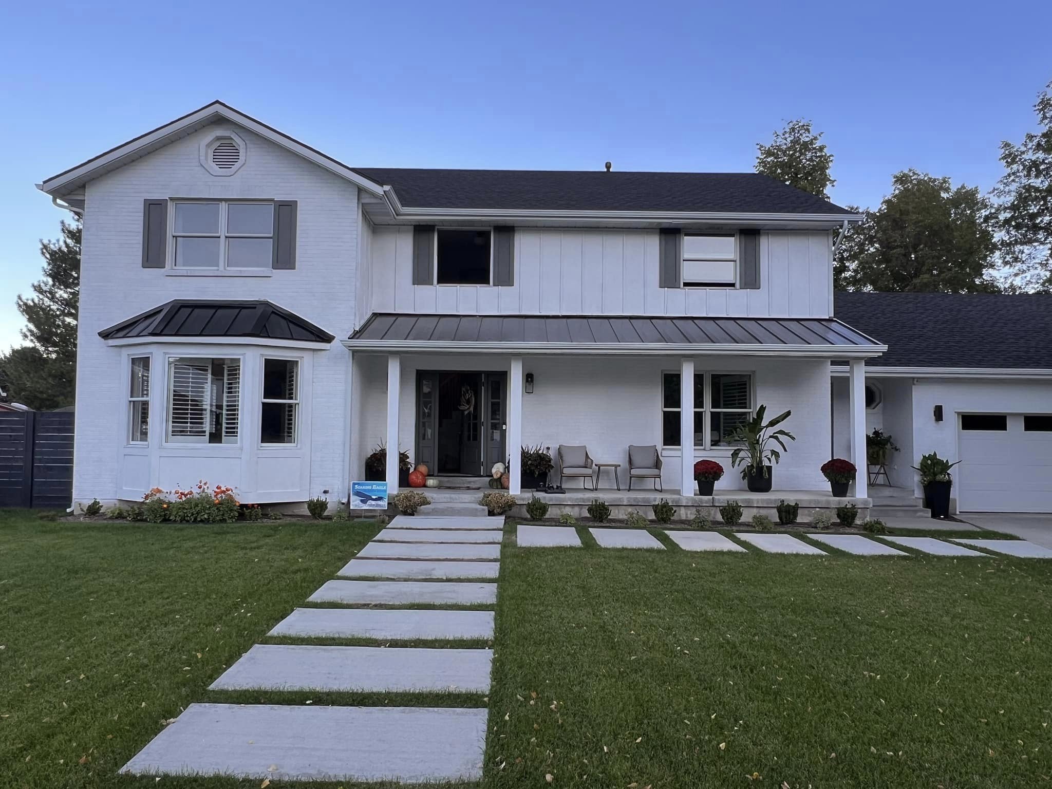 White home with black roof and windows