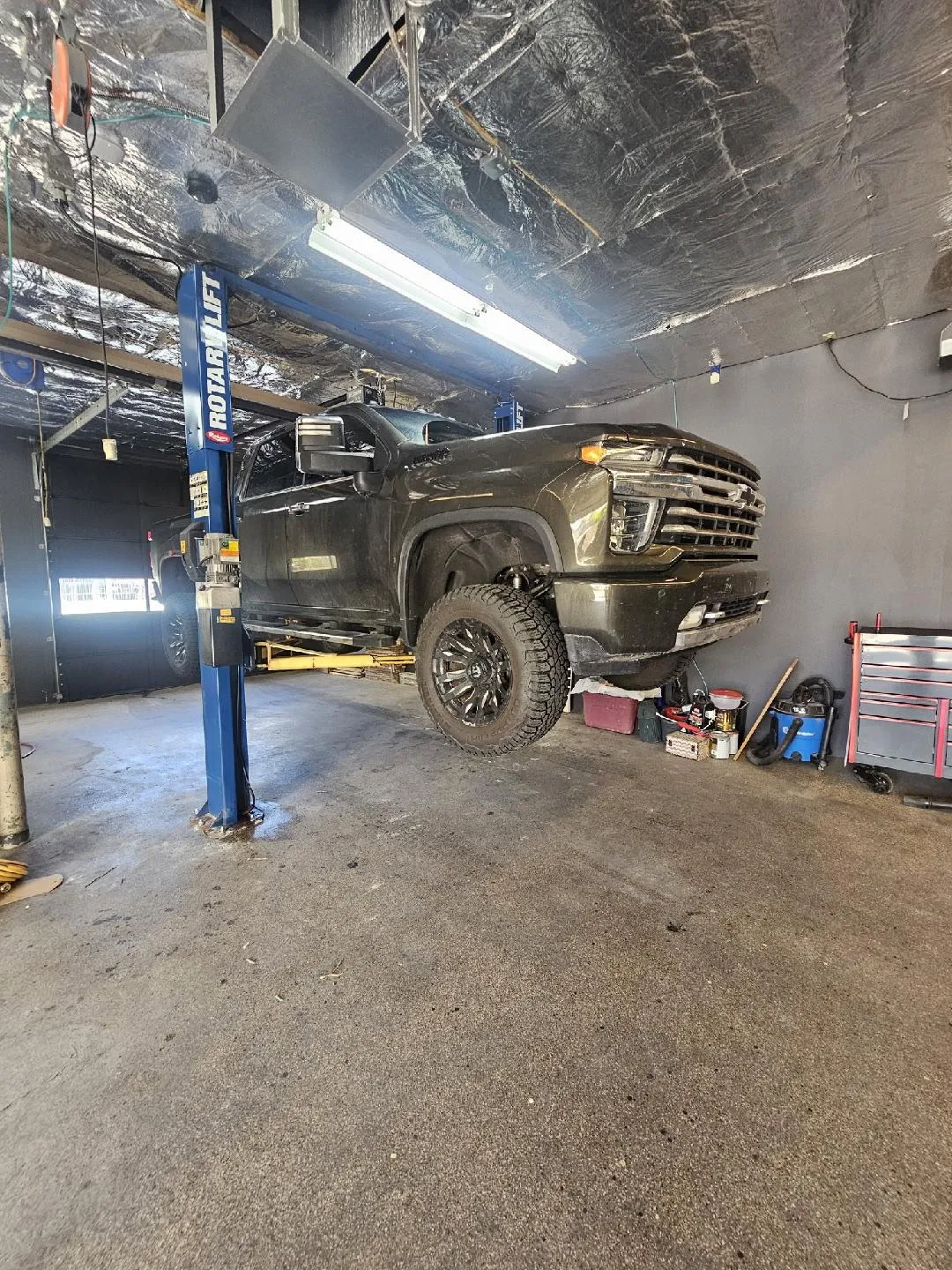 Truck on Lift Side View at Awesome Auto Repair in Tooele UT