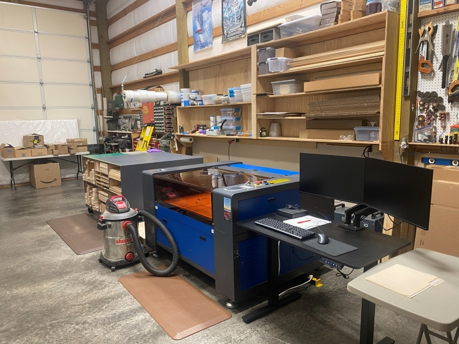 The Kit Cutters laser cutter and workstation set up at the new Toledo, Washington shop in 2025.