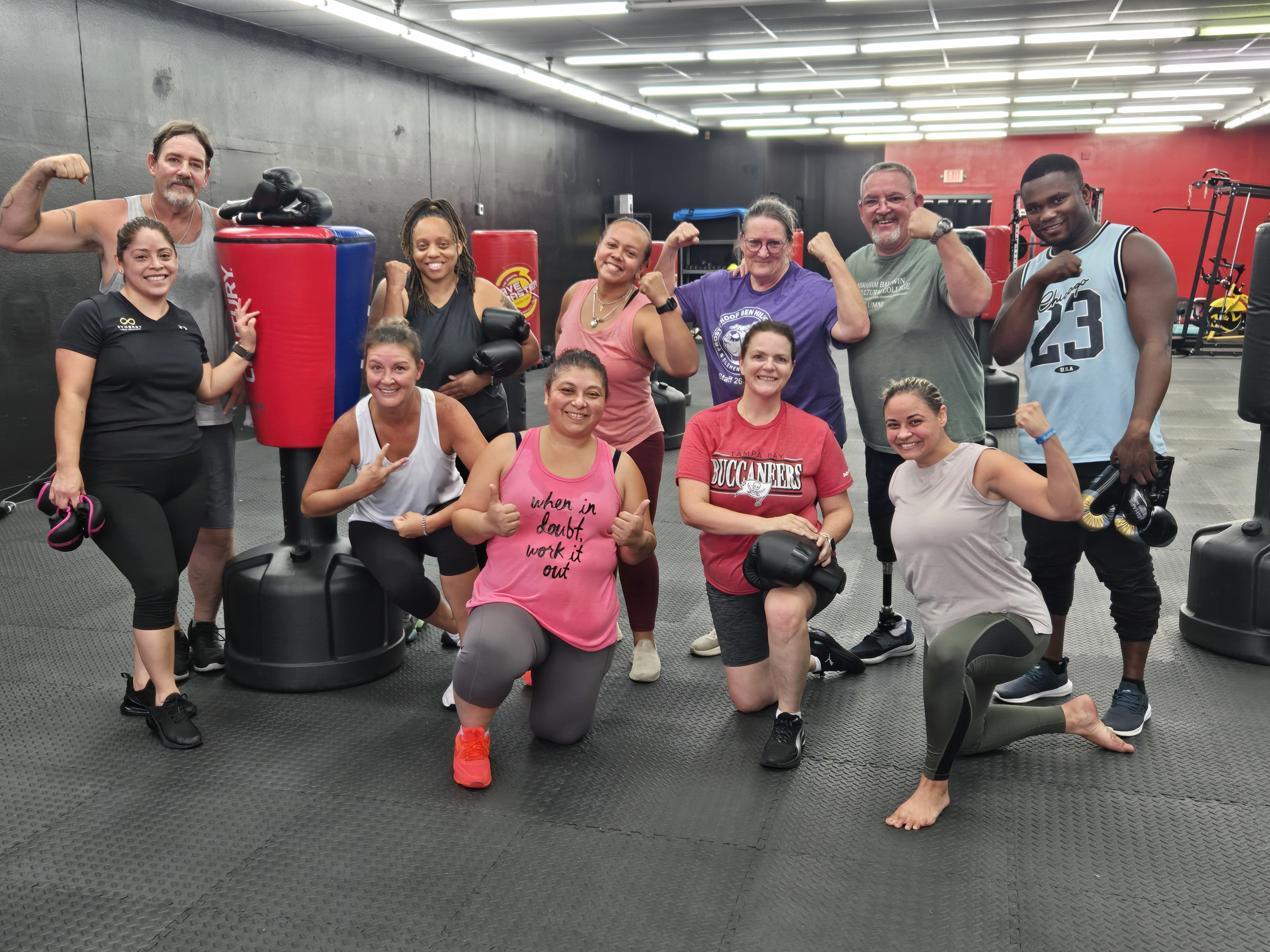 Revive Fitness & Recovery members celebrating after a kickboxing class