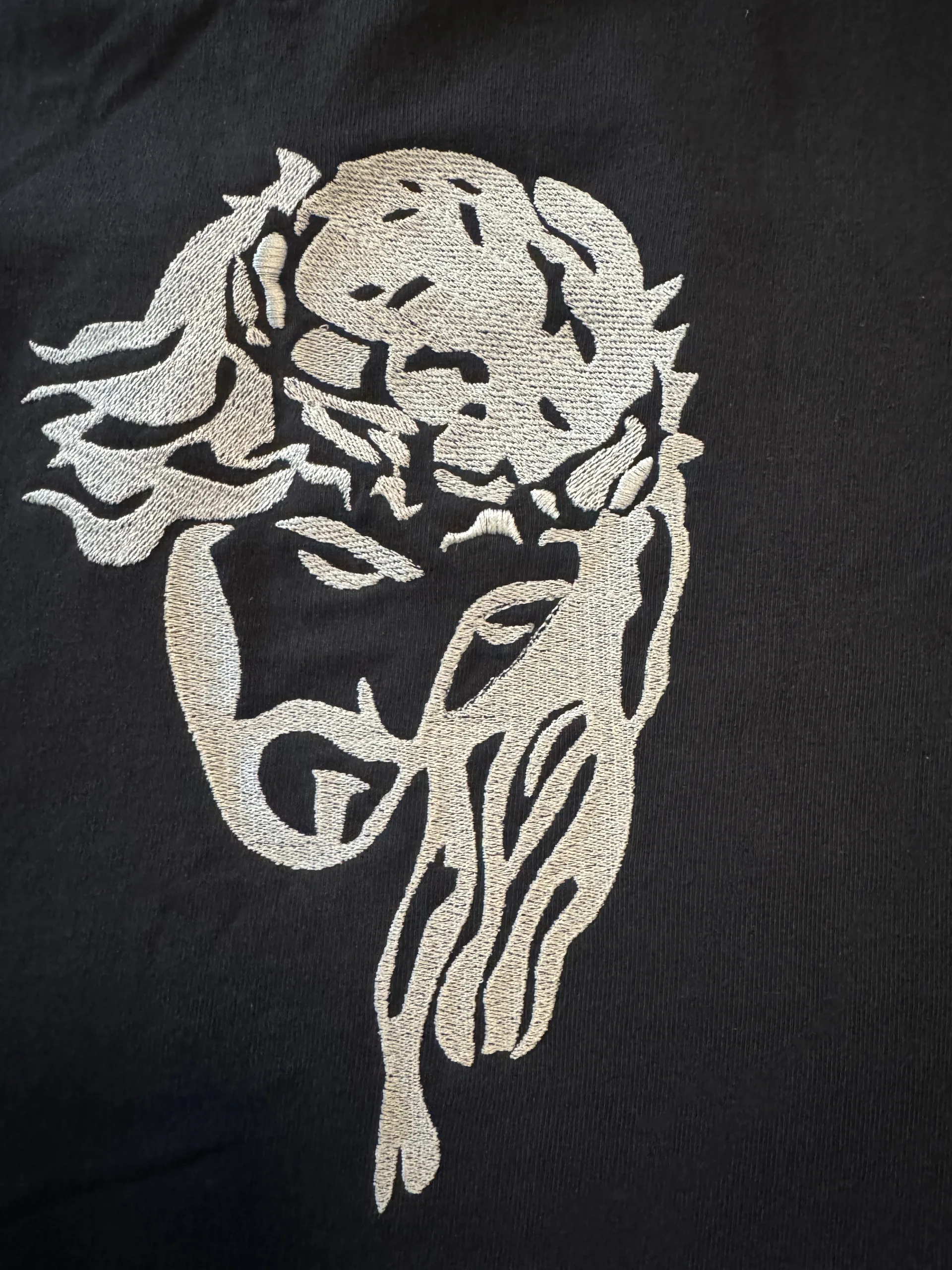 Intricate silver thread religious embroidery