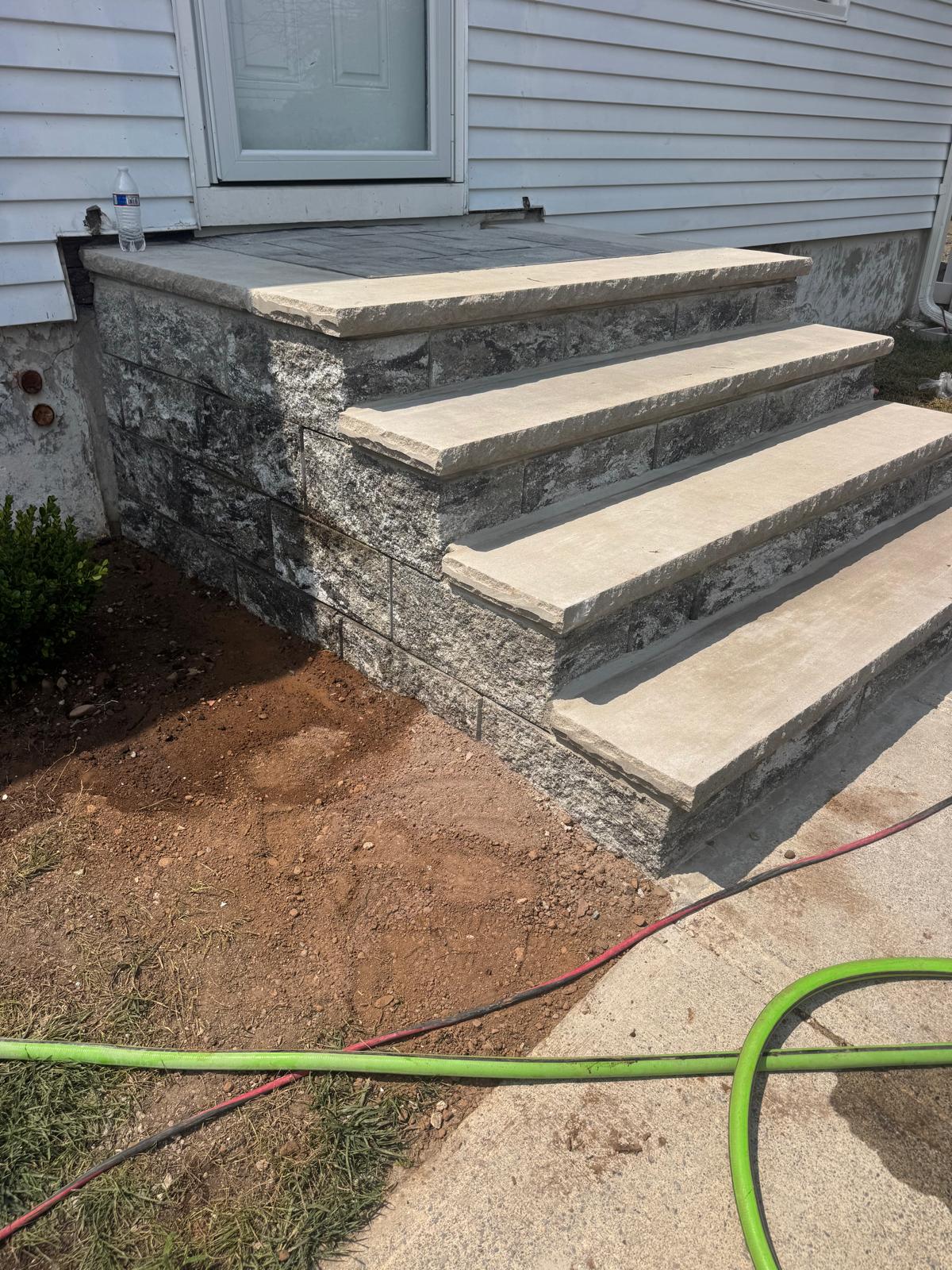 Stone block retaining wall installation in Essex County NJ