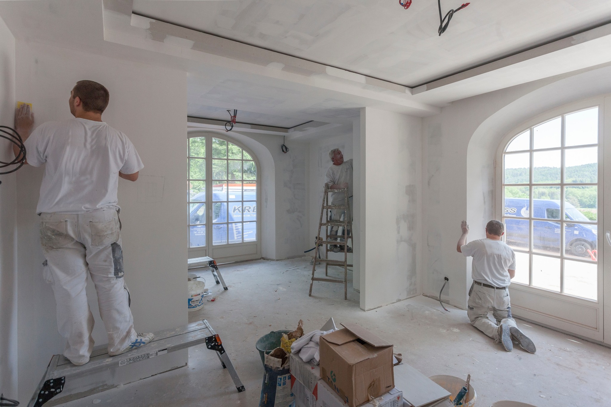 Painters working on interior walls
