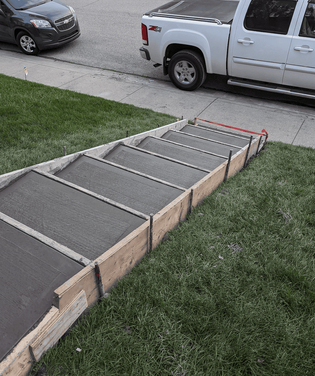 Concrete stairs leading to home entrance