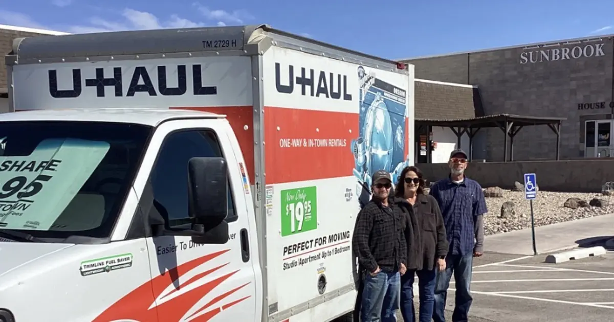 Sunbrook Secure Storage team members with a U-Haul moving truck available for rent in St. George, Utah