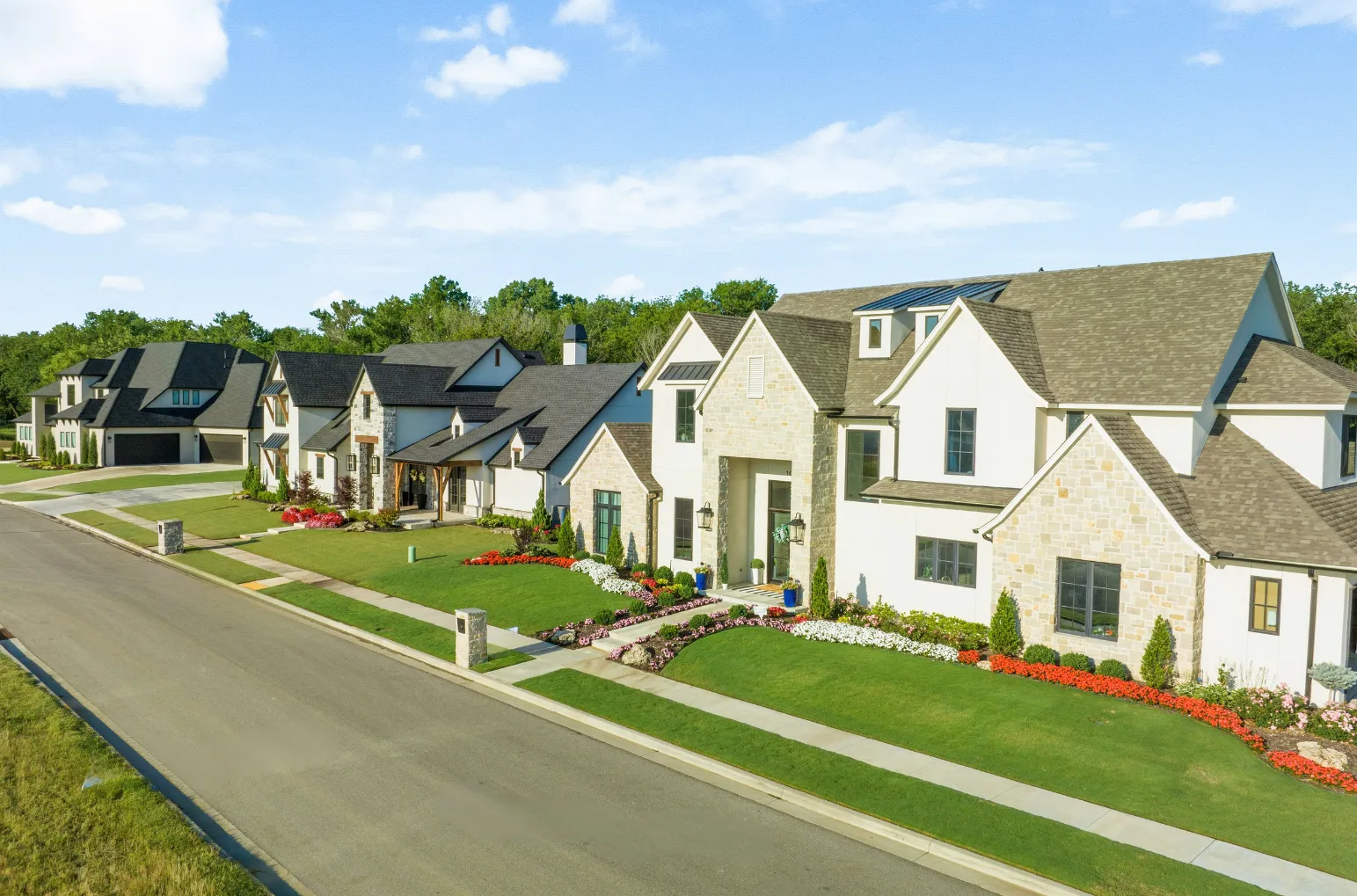 Beautiful Oklahoma neighborhood with upscale homes, manicured lawns, and mature trees