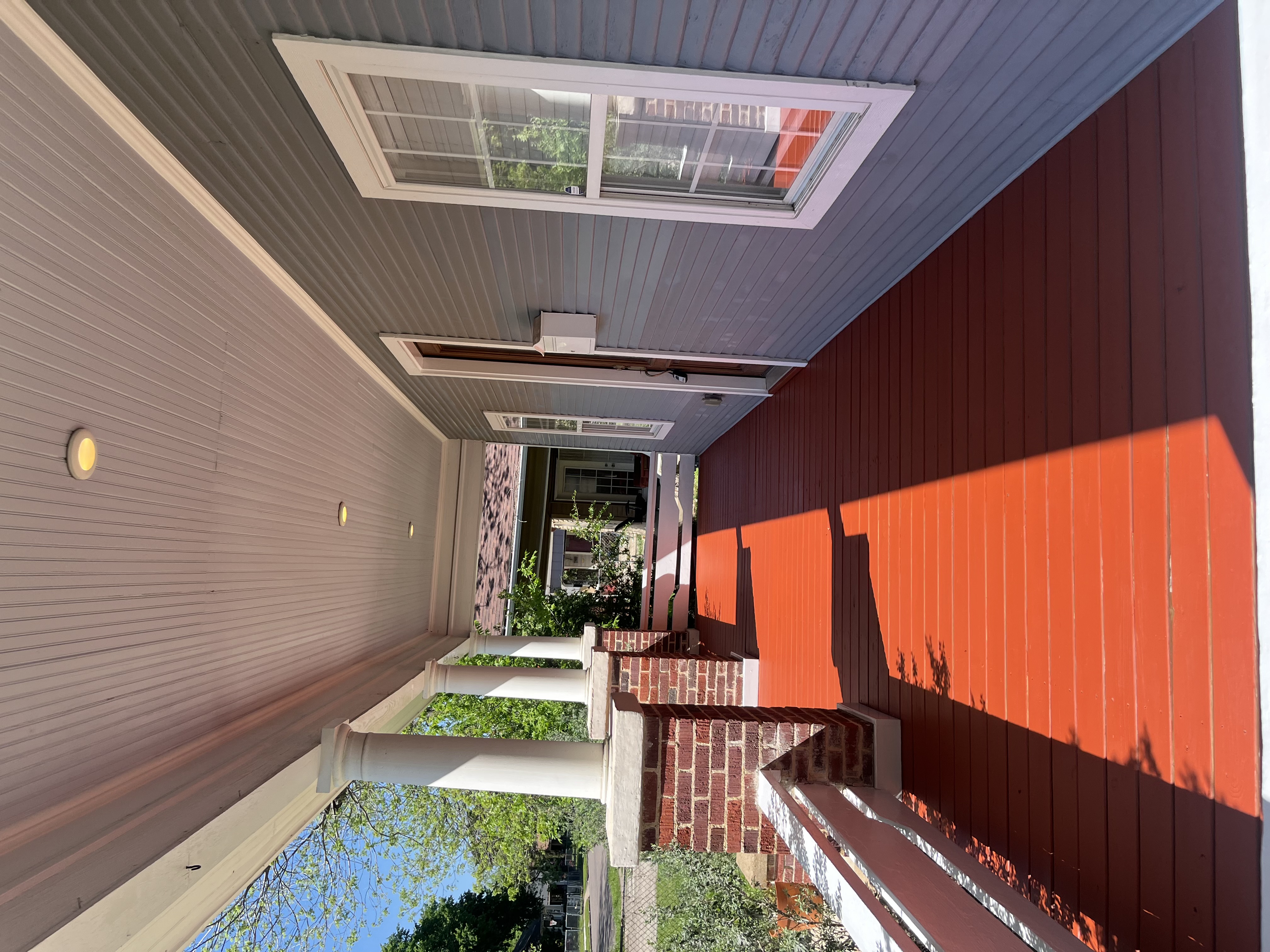 Same porch from side angle showing full length of covered porch