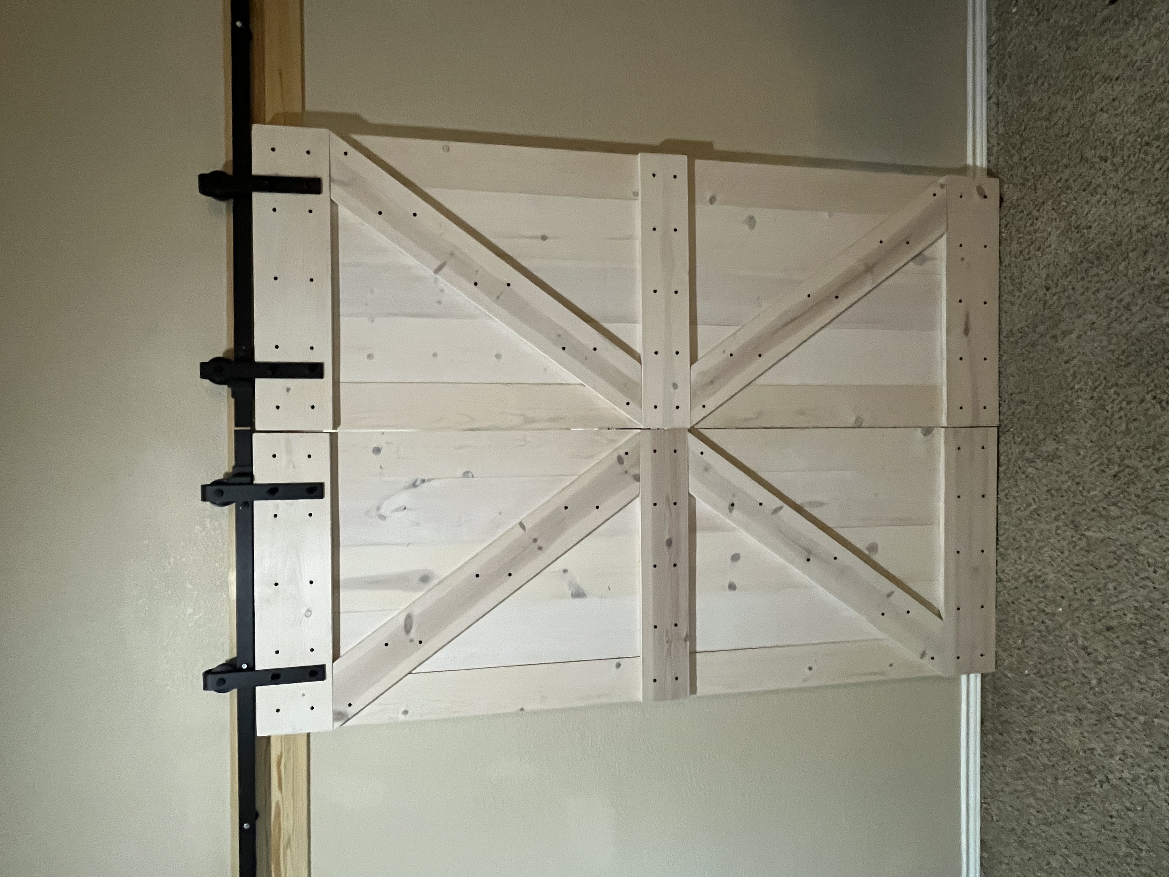 Double barn door with black hardware, whitewash finish