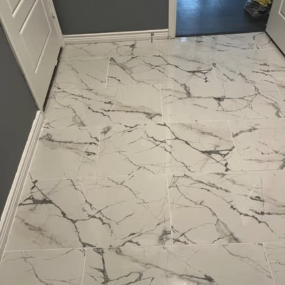 Large Format Marble-Look Tile Install - Marble-look large format tile installed in a hallway/entryway