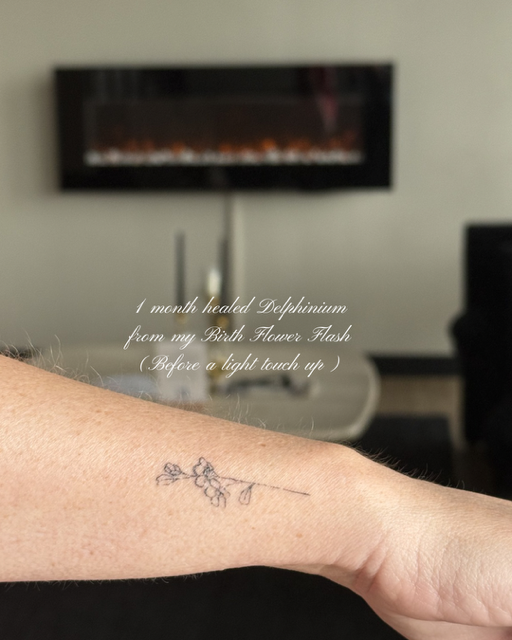 Healed Delphinium birth flower fine line tattoo by Clarissa Victoria Rosa