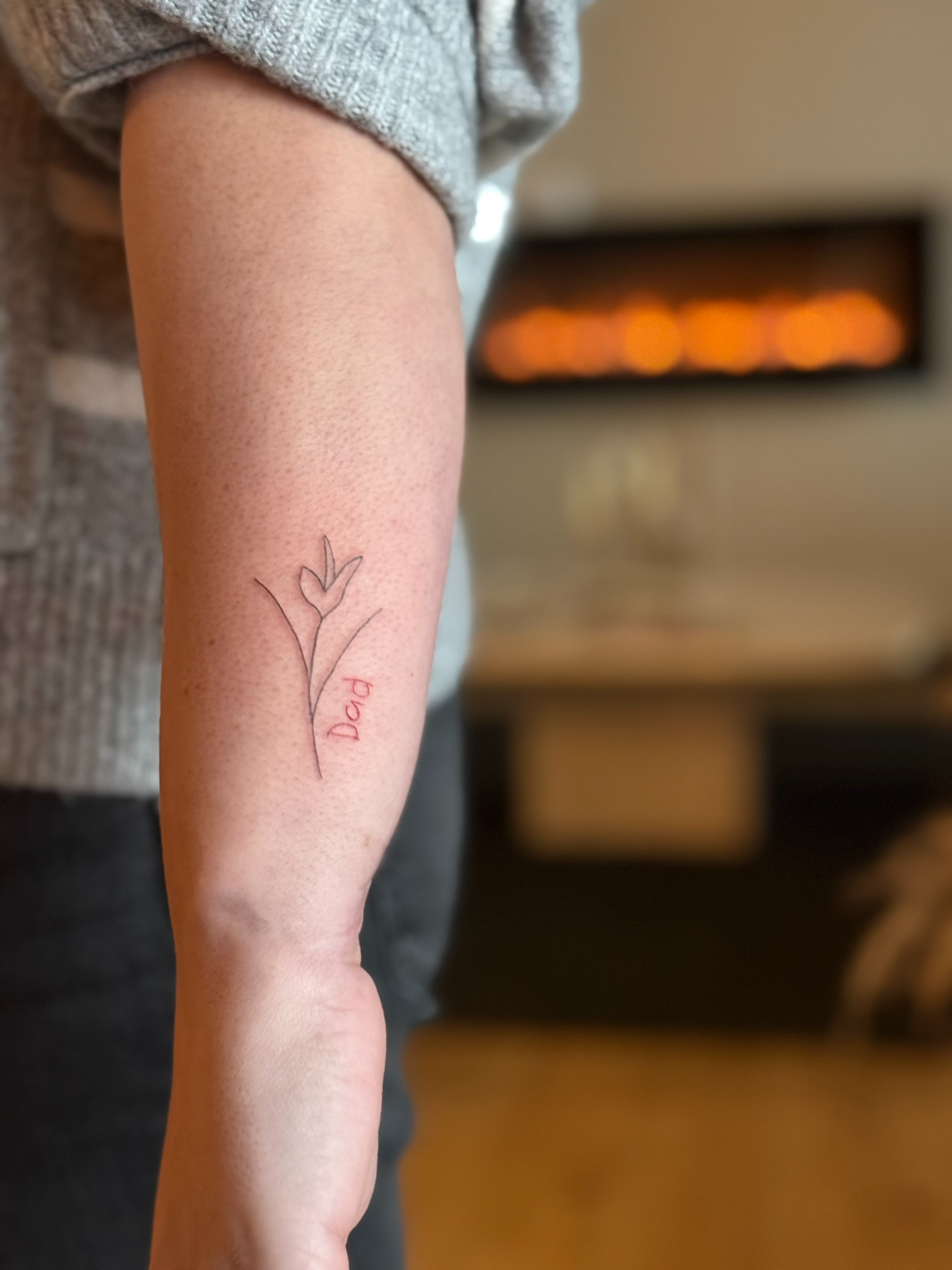 Fresh fine line floral dad tattoo