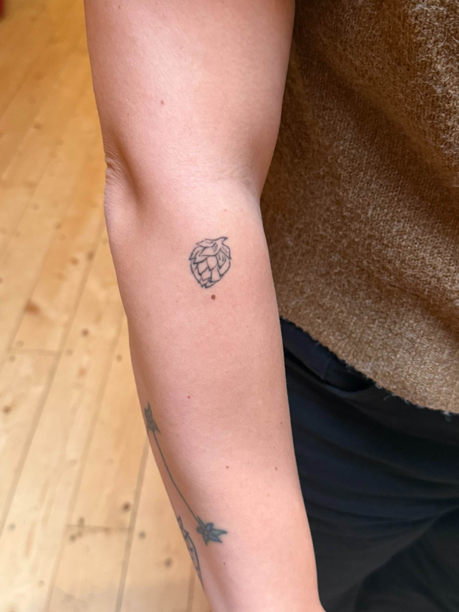 Healed delicate fine line script tattoo