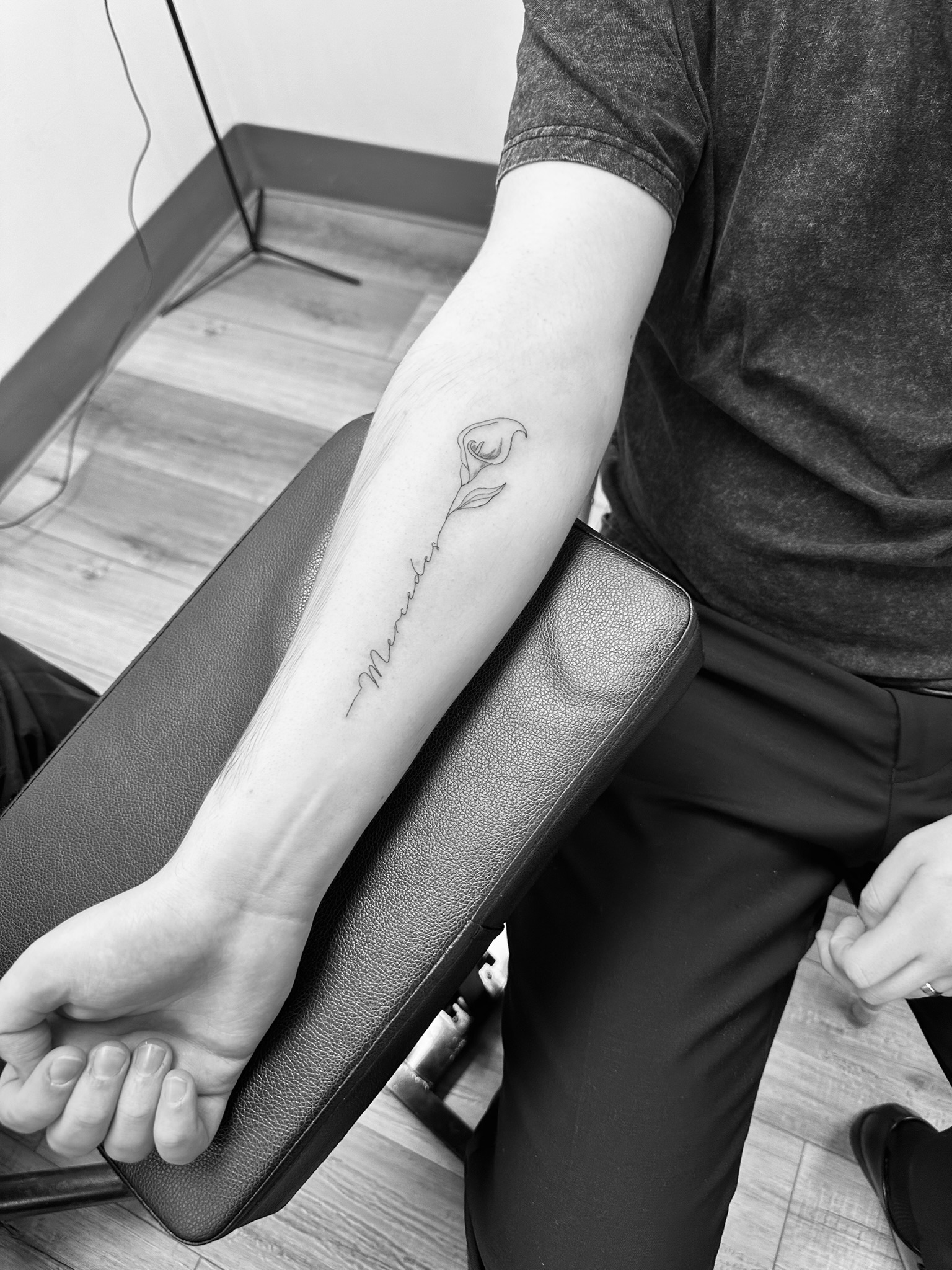 Excited wedding guests showing off their new matching delicate fine line tattoos