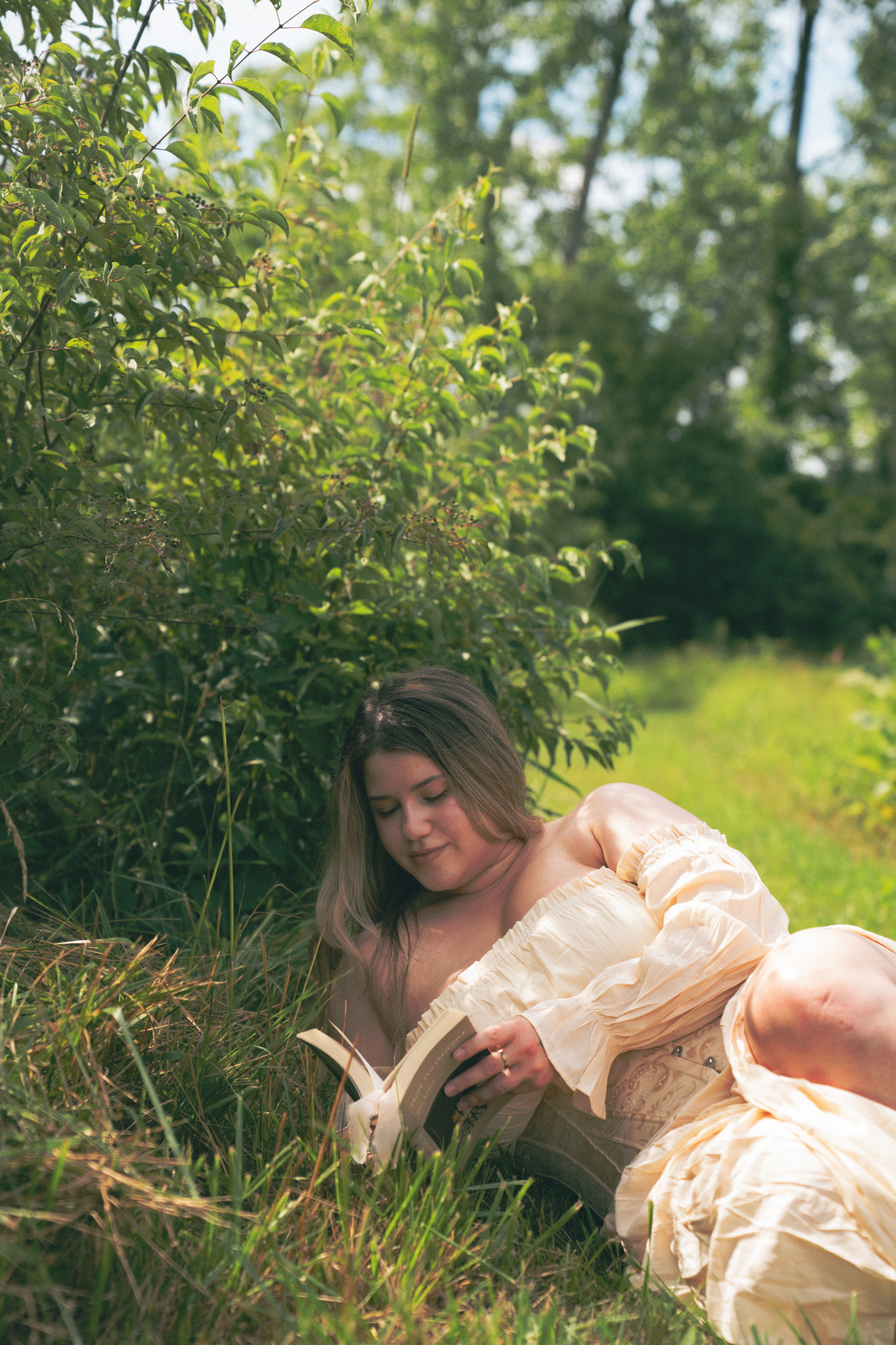 Fine line tattoo artist Clarissa Victoria Rosa outdoors in a natural setting.