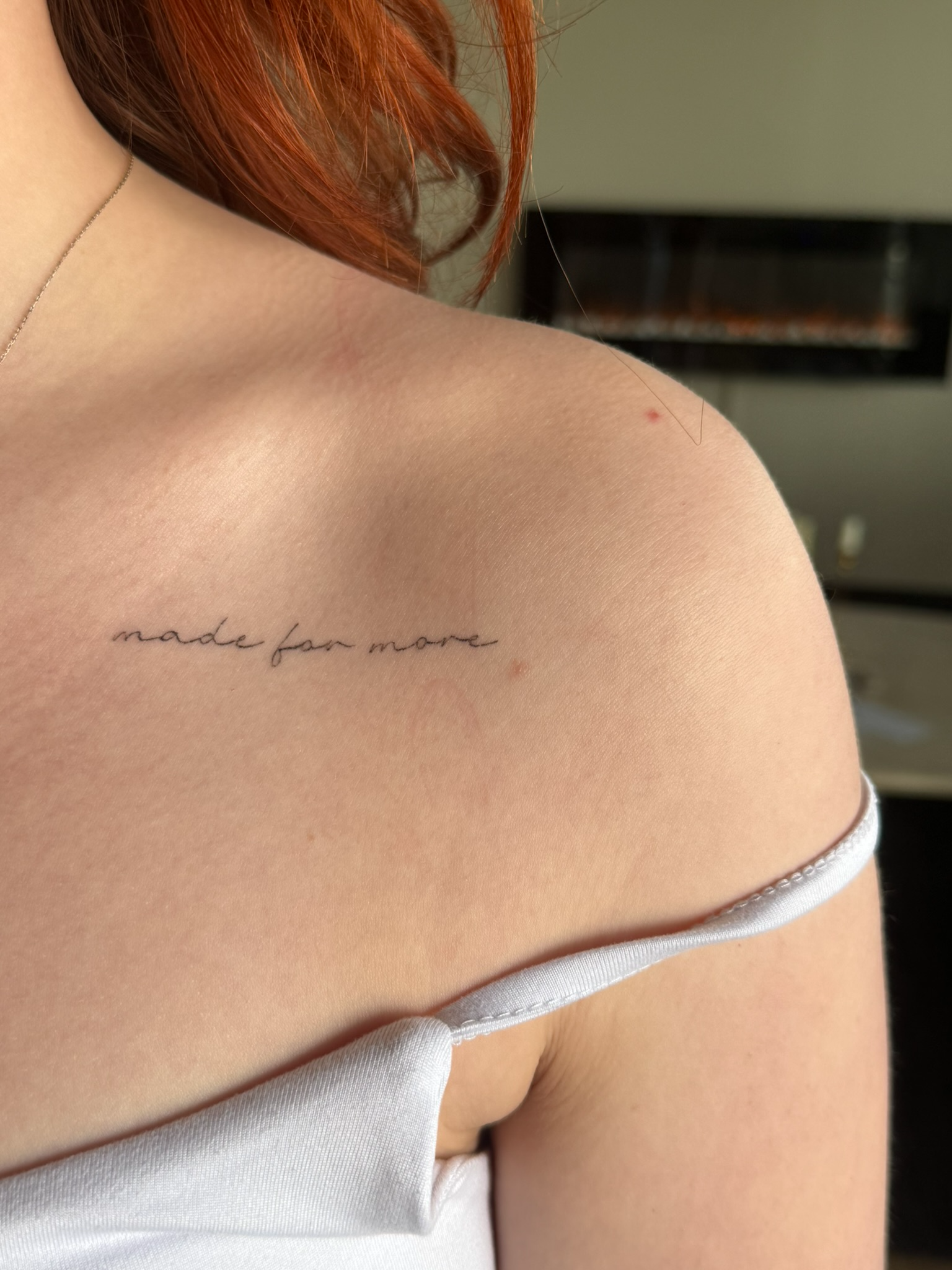 Healed fine line script tattoo