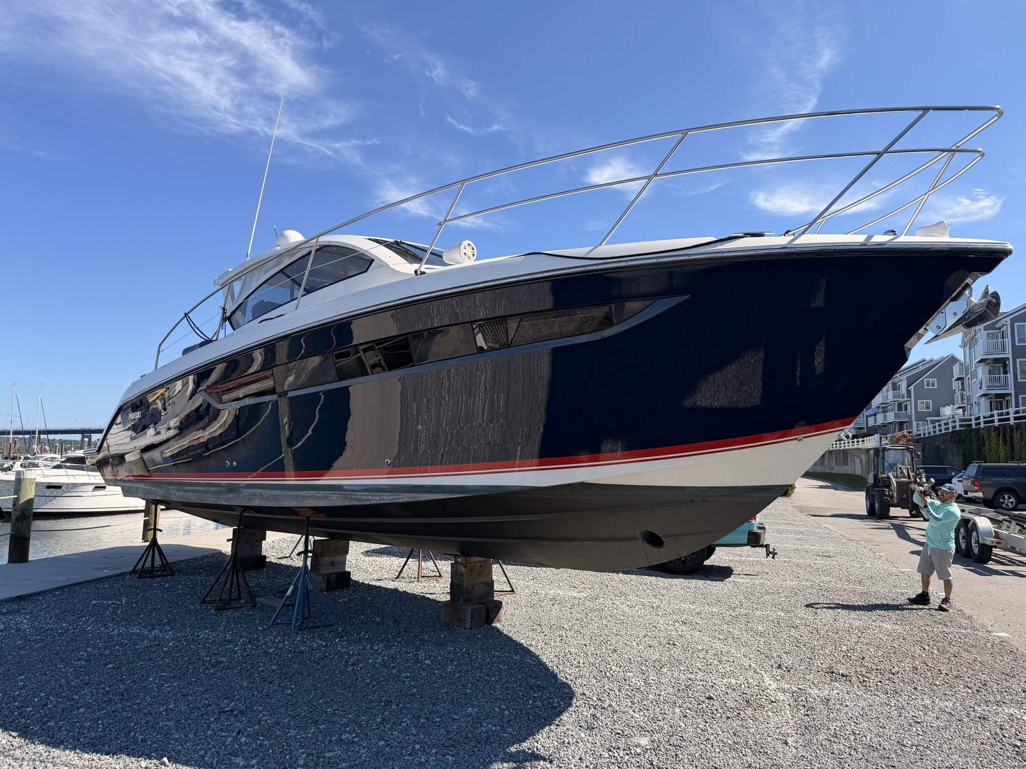 2014 Pursuit dark navy hull protected with Yacht Armor Shield clear film — bow-on angle at Borden Light Marina Fall River MA