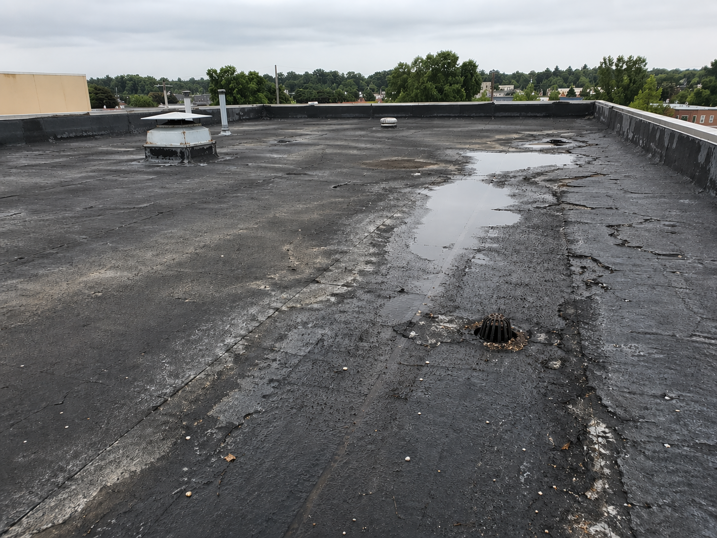 Damaged flat roof before