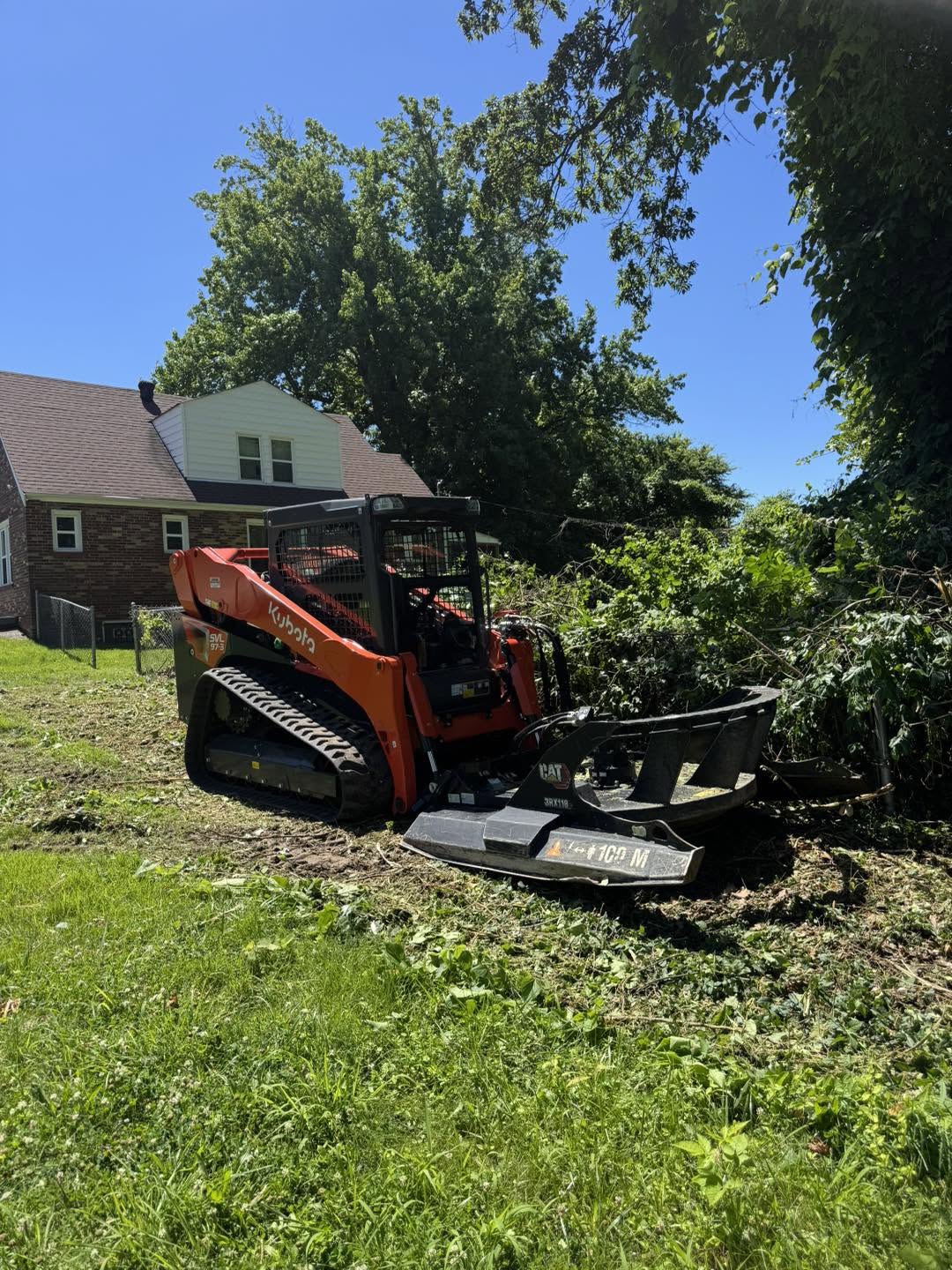 Kubota forestry mulcher on residential property