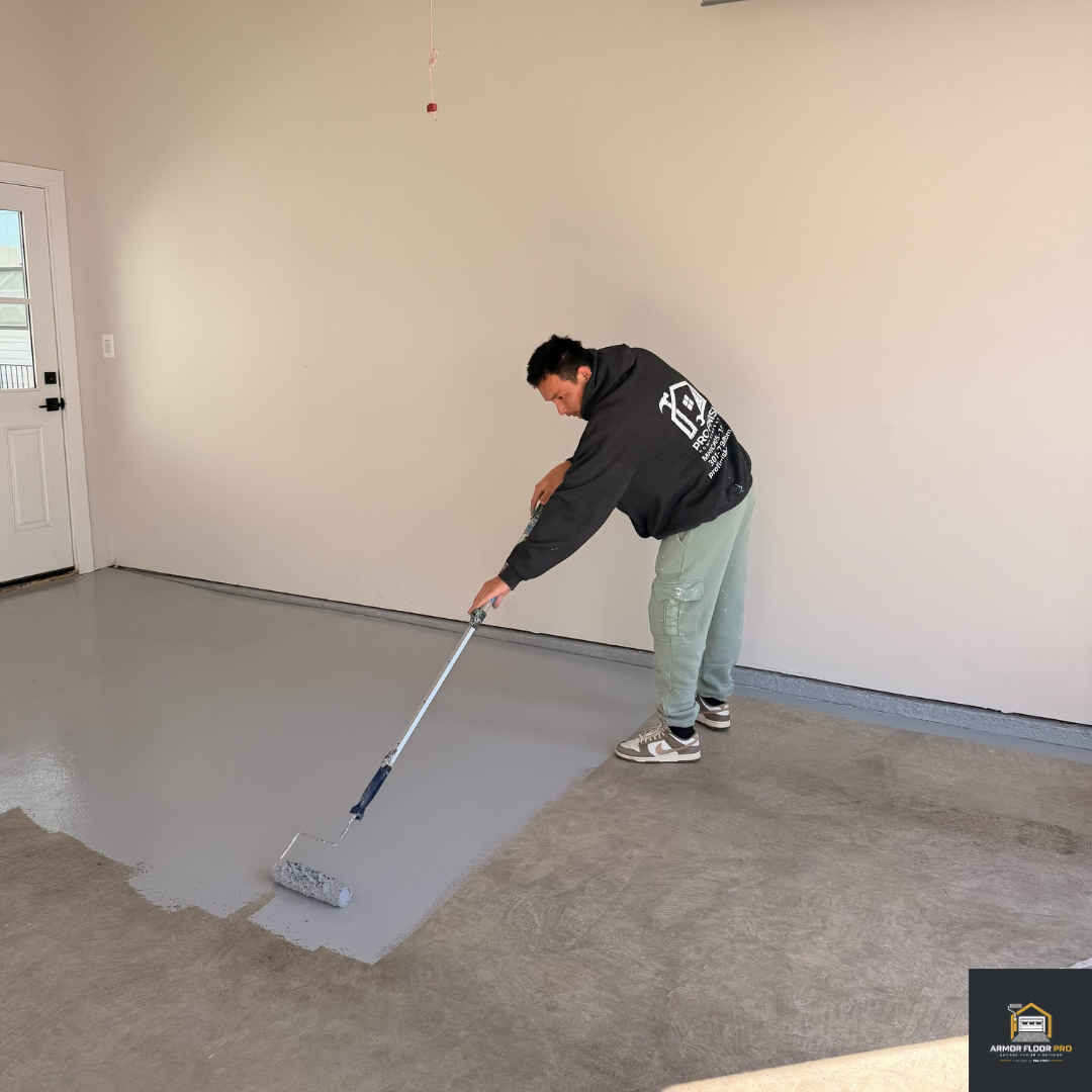 Worker applying base coat