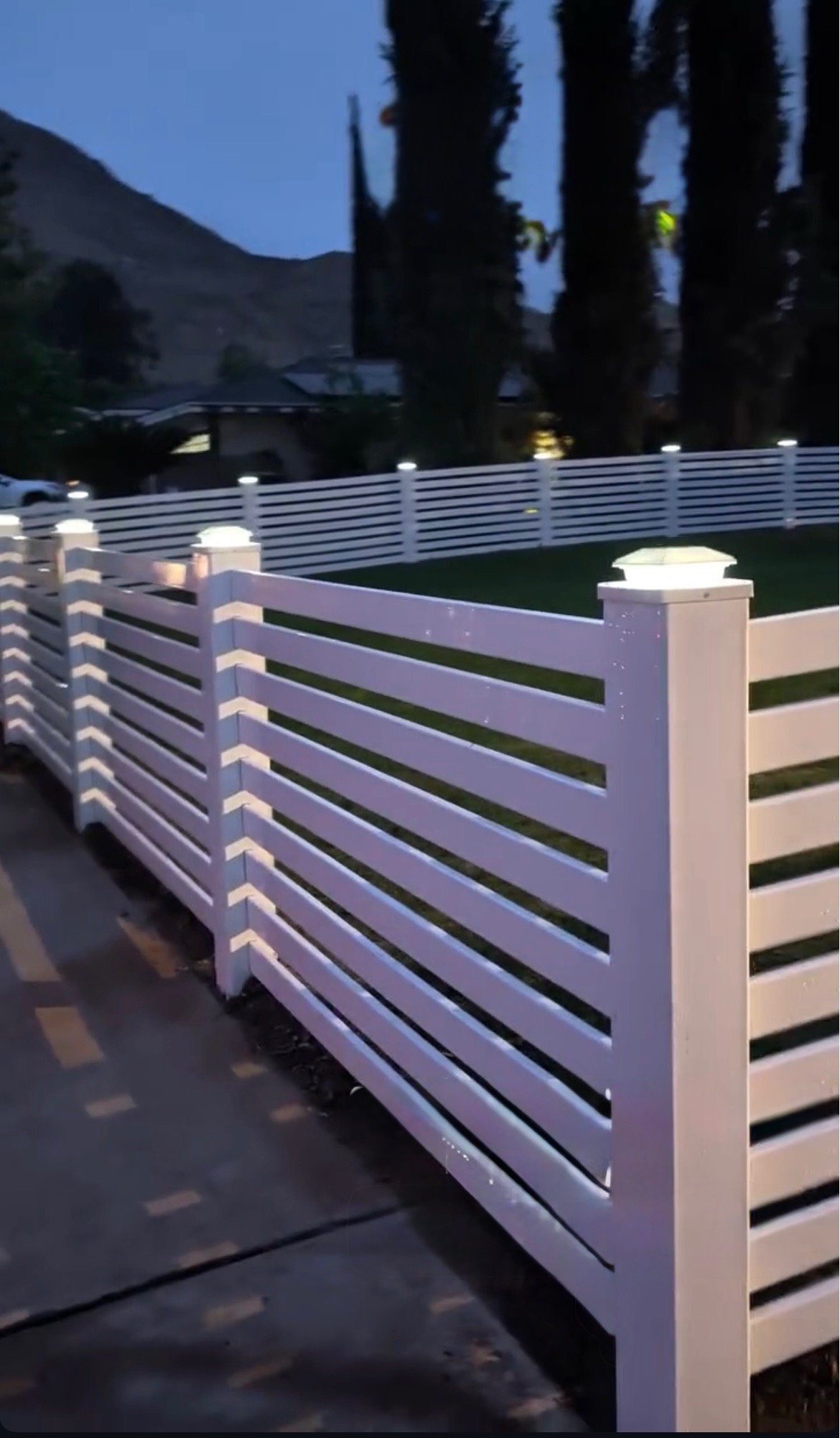 Beautiful white vinyl fence with integrated lighting